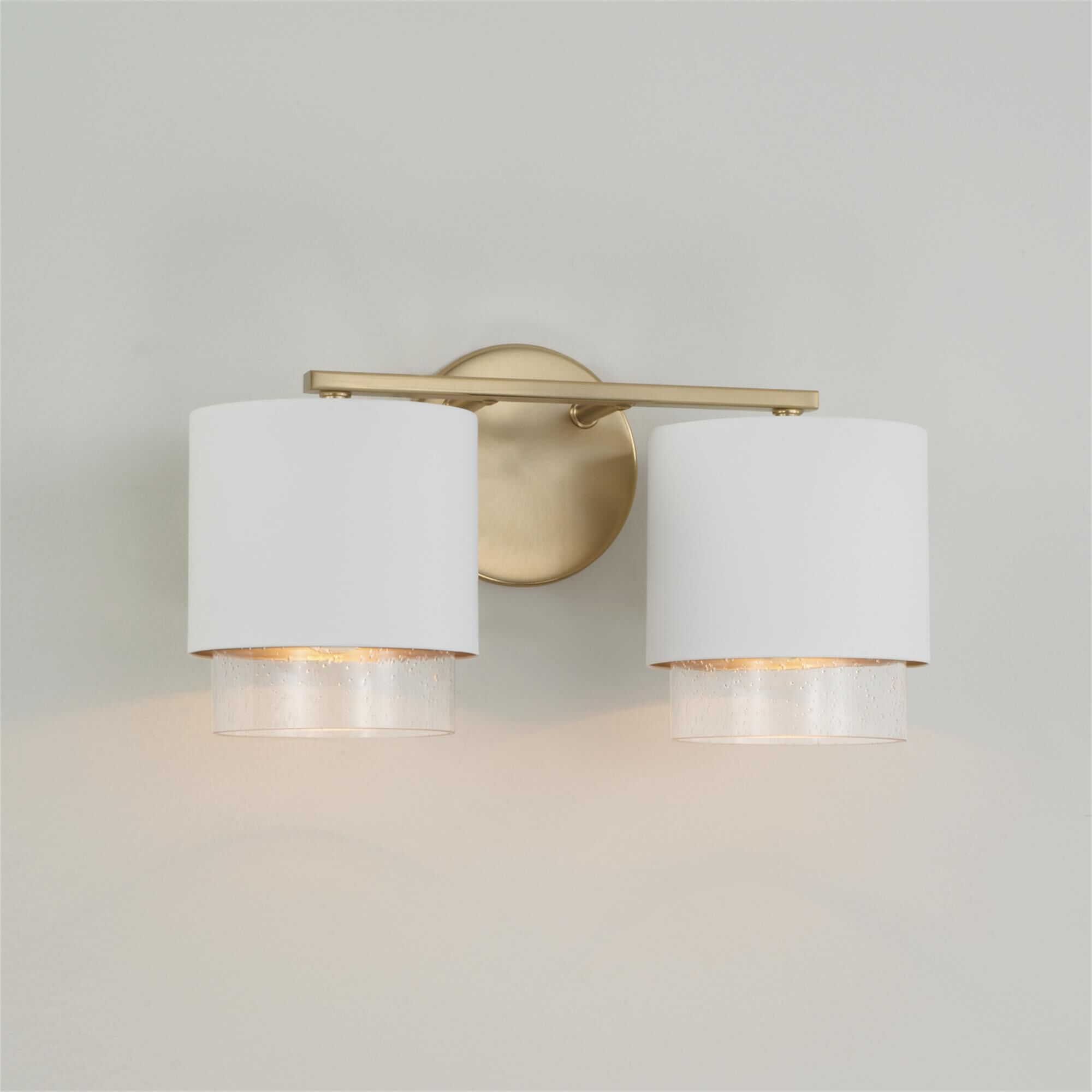 Shown in Matte Brass and White finish and Clear Seeded glass and Metal with Brass Interior shade