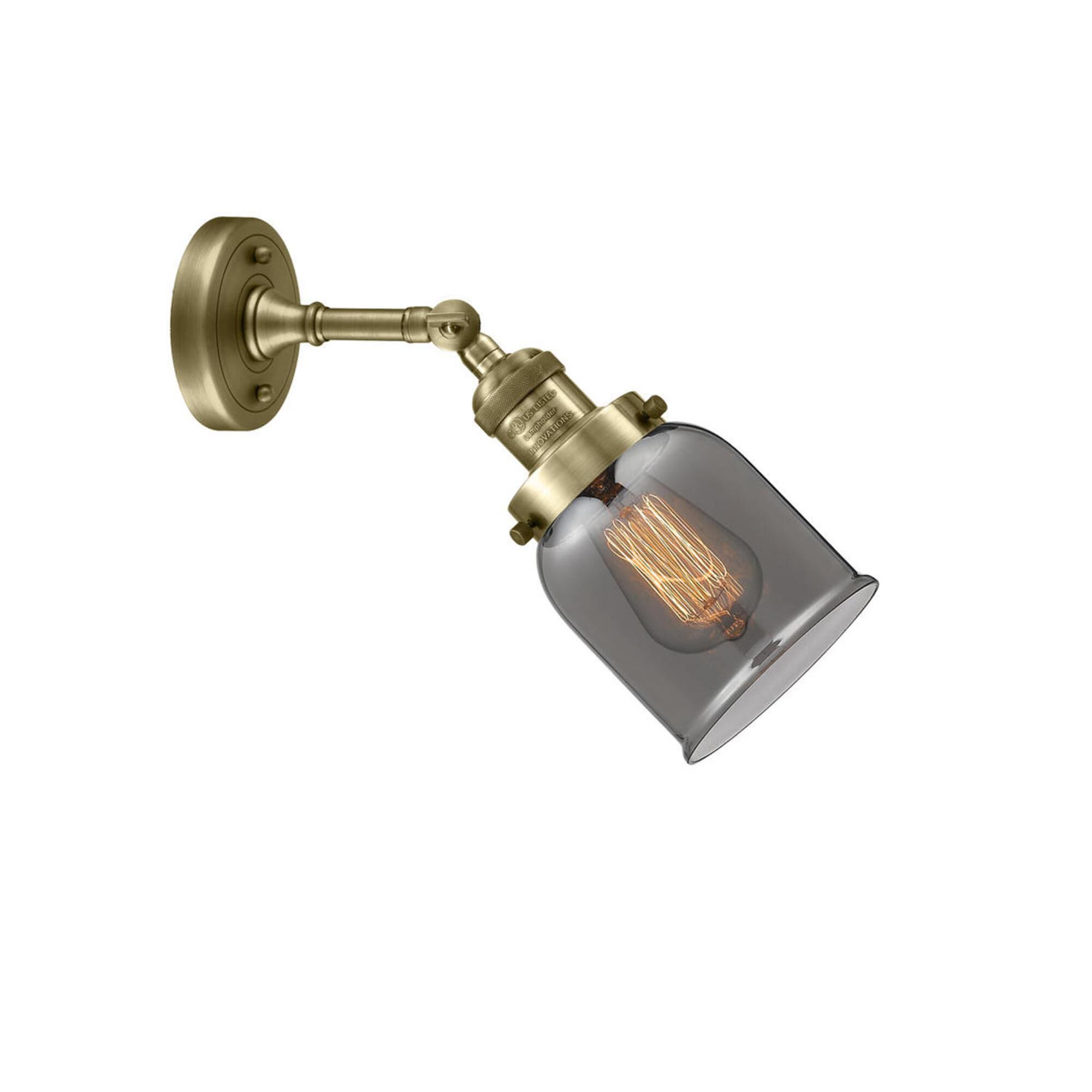 Shown in Antique Brass finish and Plated Smoked glass and None accent