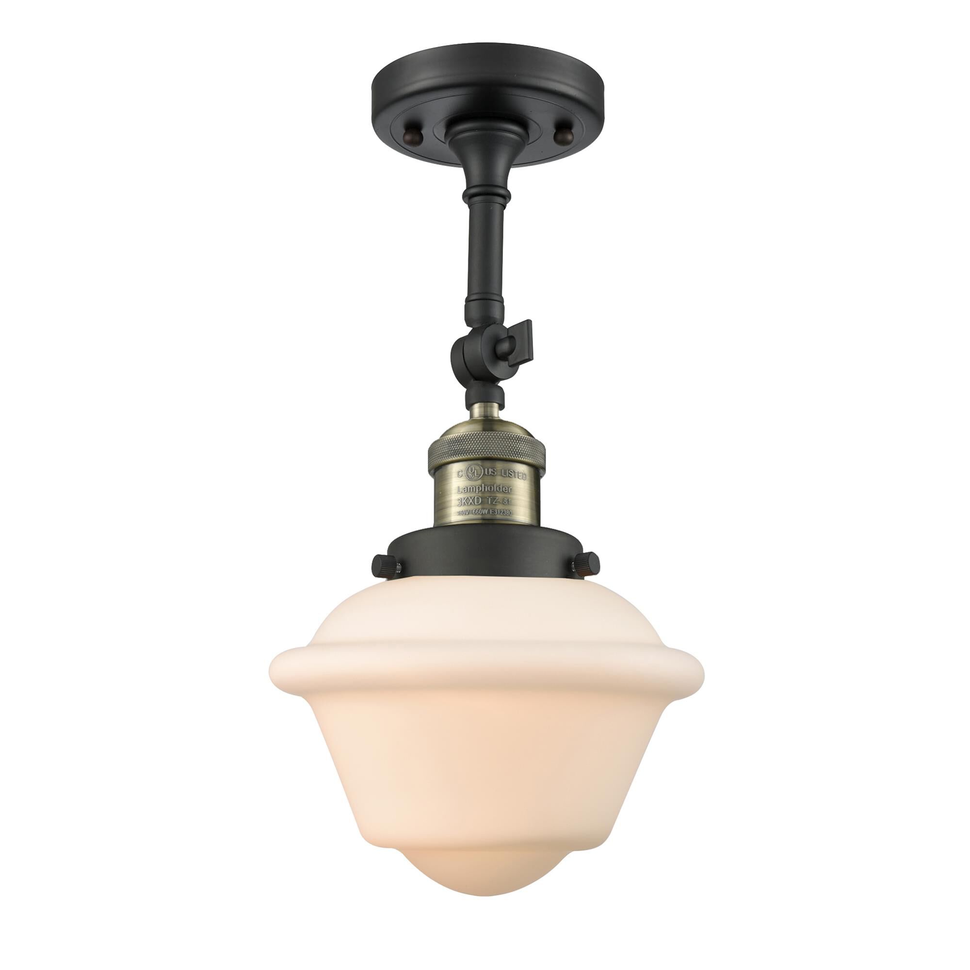 Shown in Black Antique Brass finish and Matte White Cased glass