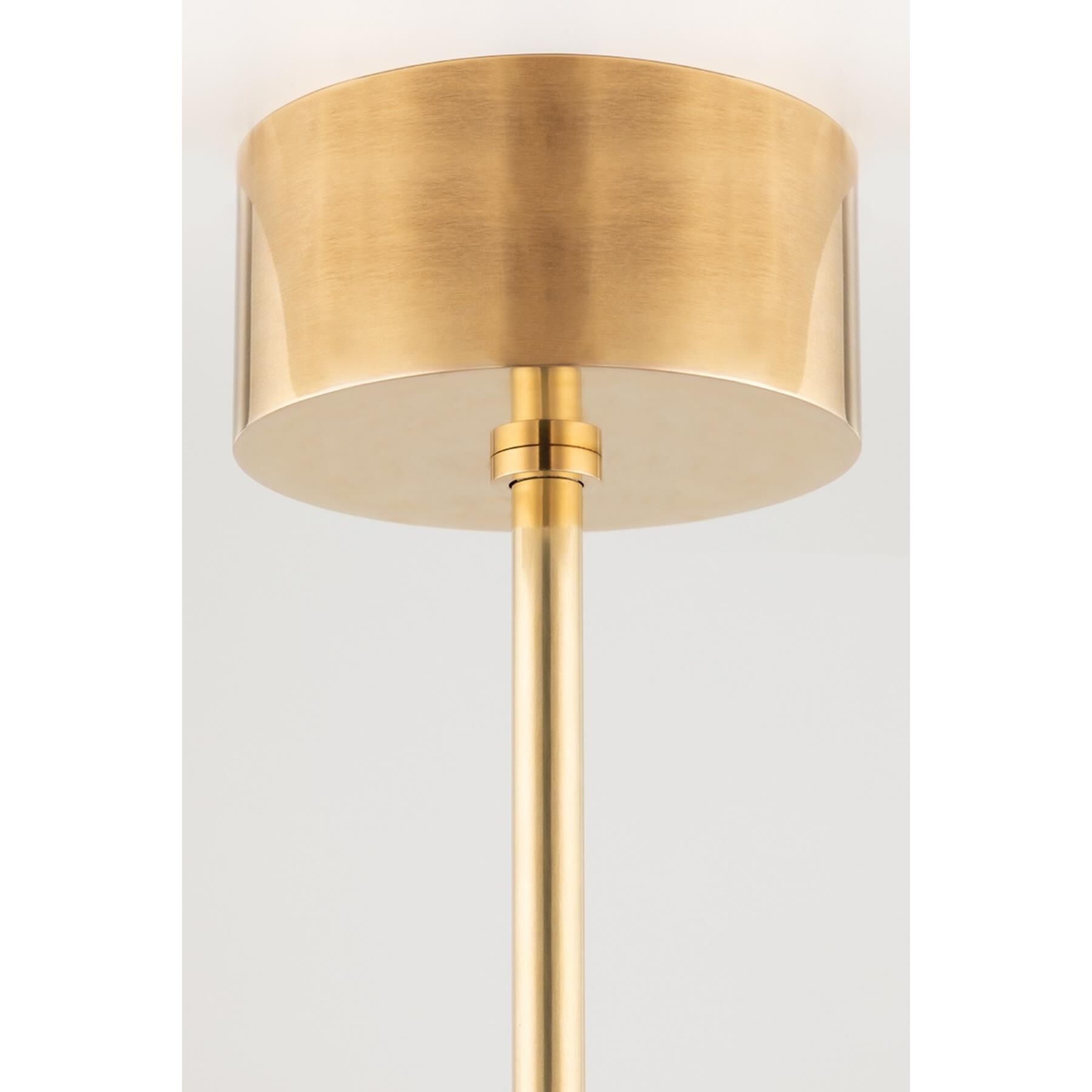 Shown in Aged Brass finish and Matte White Glass And Metal shade