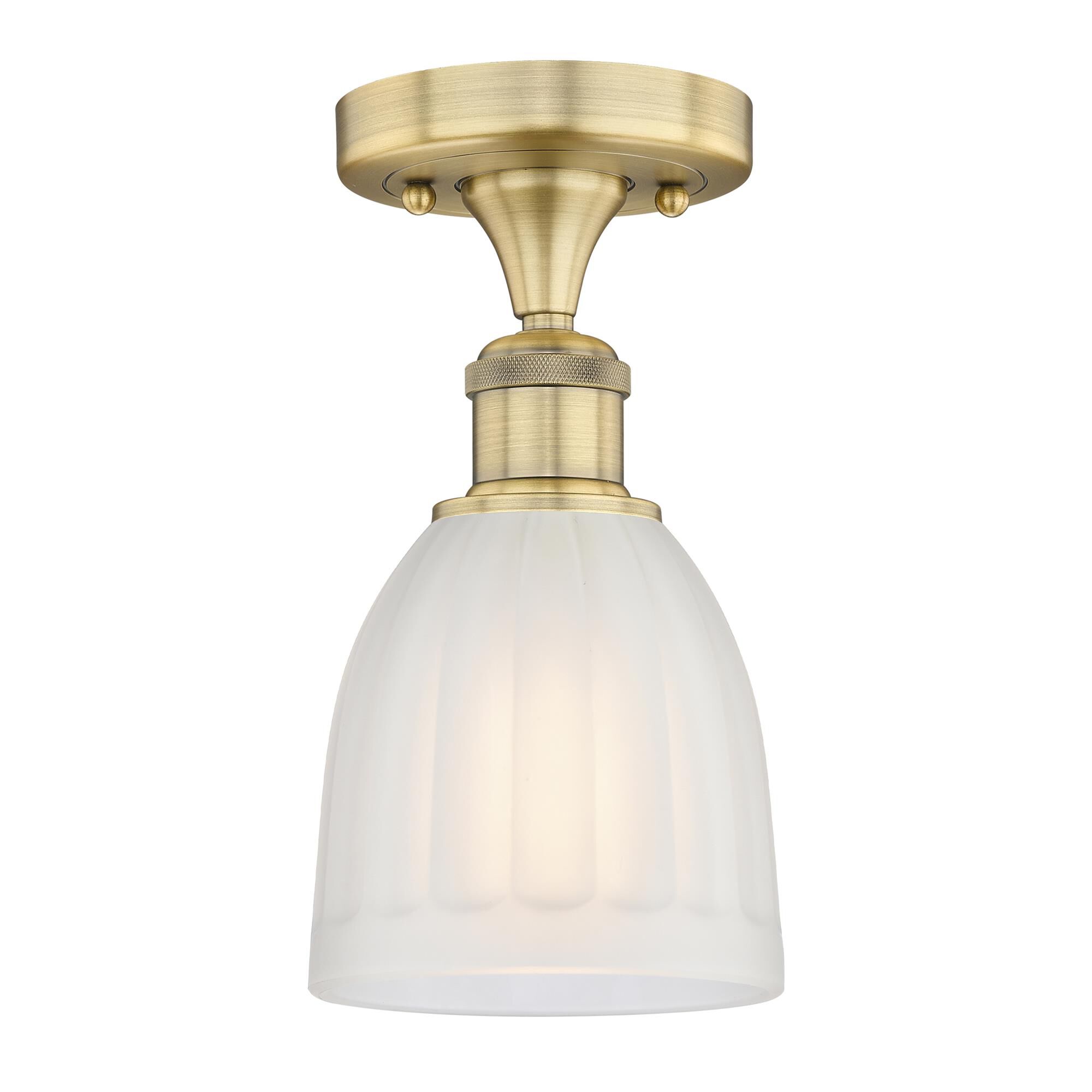 Shown in Brushed Brass finish and White glass