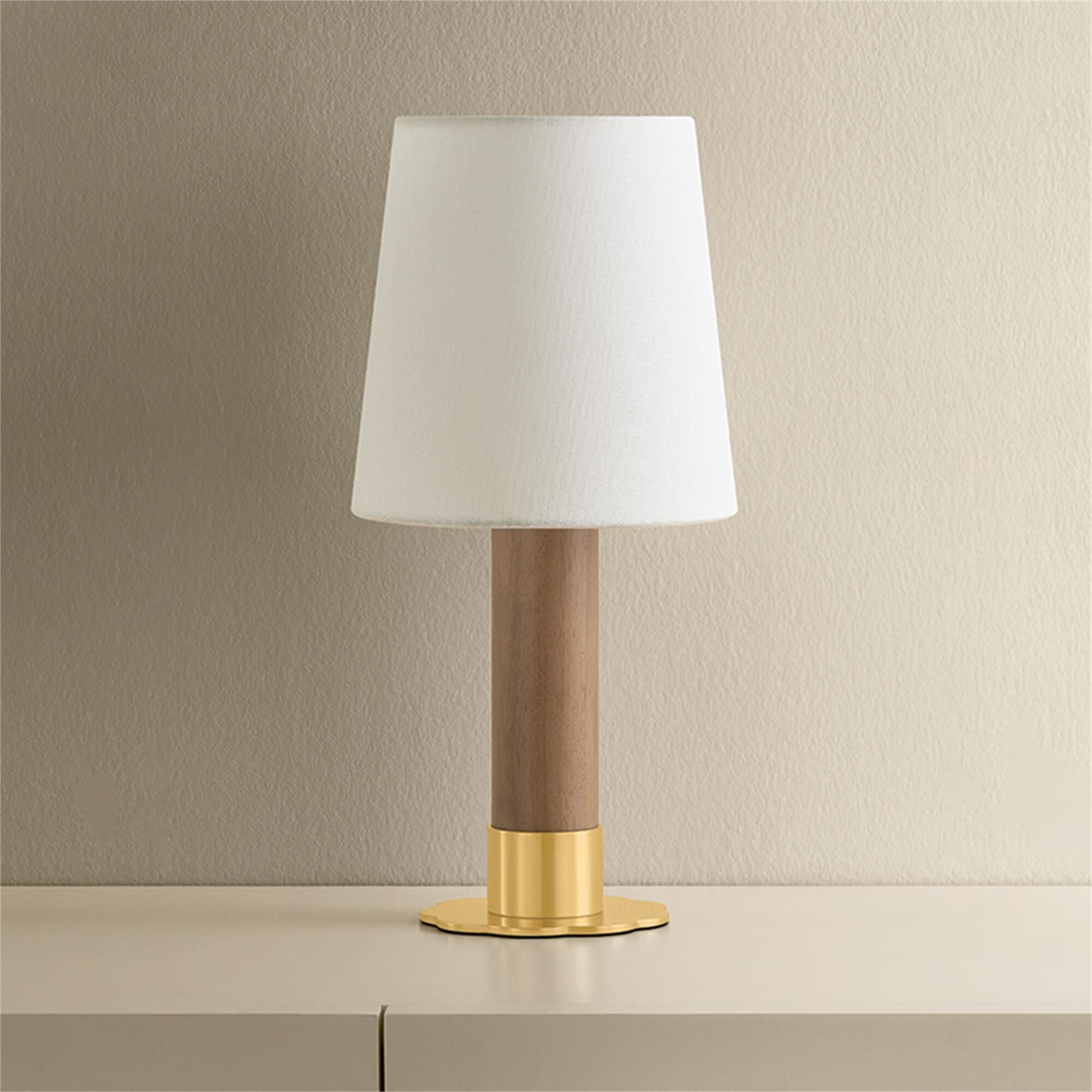 Shown in Aged Brass finish and White Linen shade