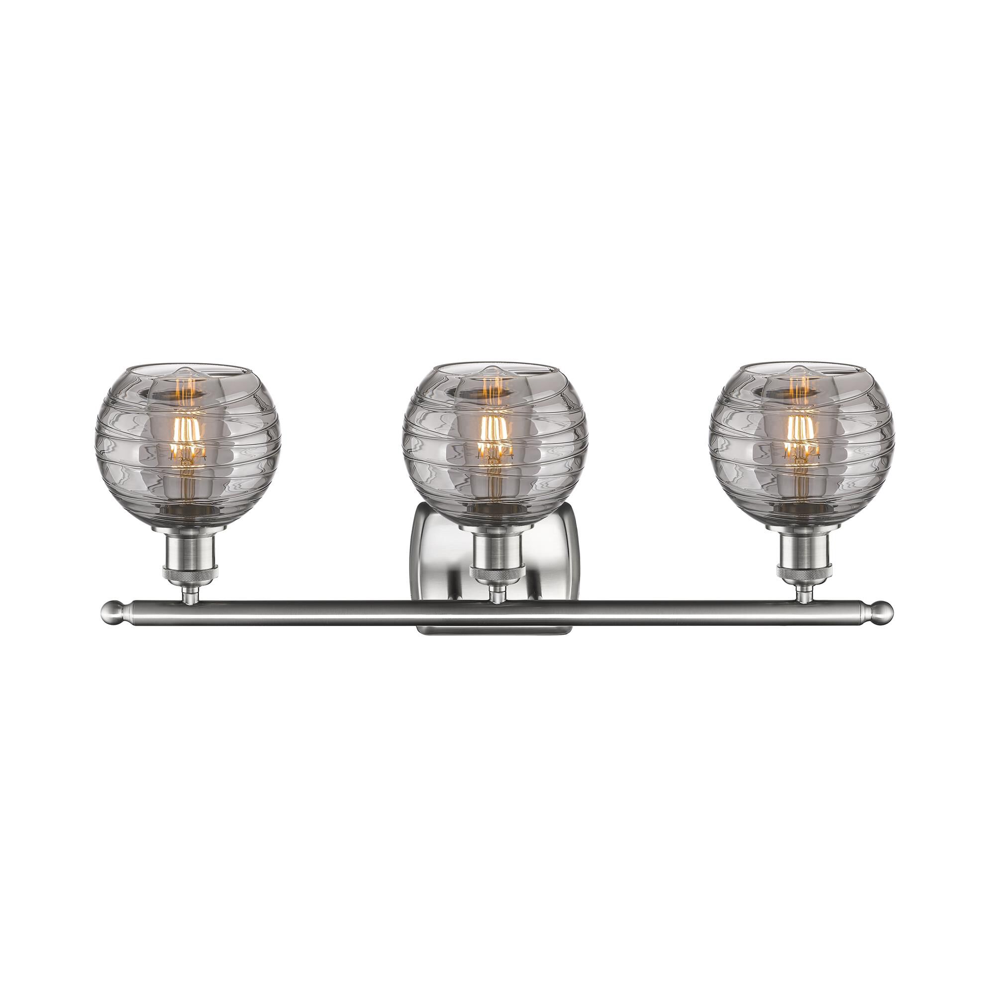Shown in Brushed Satin Nickel finish and Light Smoke Deco Swirl glass