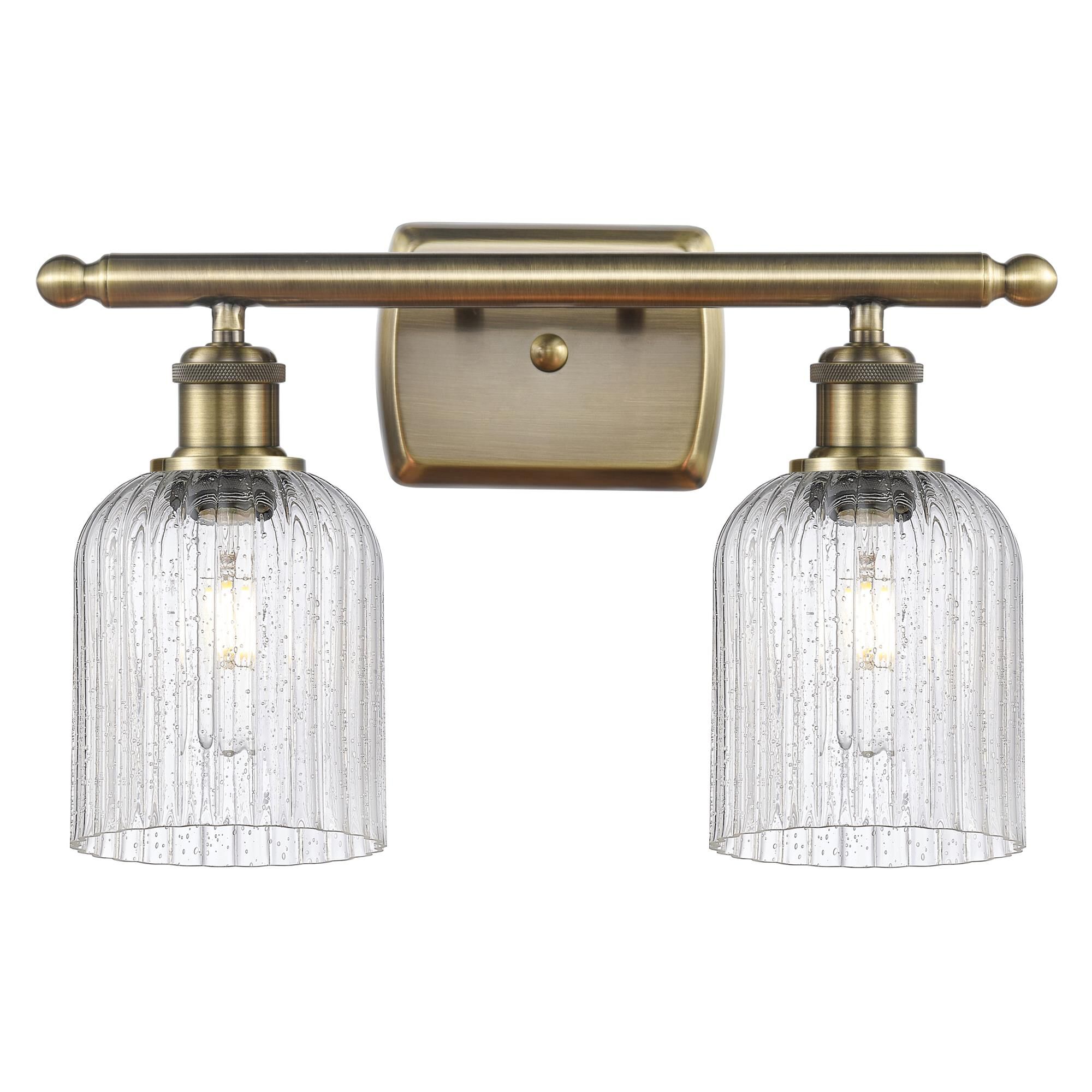 Shown in Antique Brass finish and Seedy shade