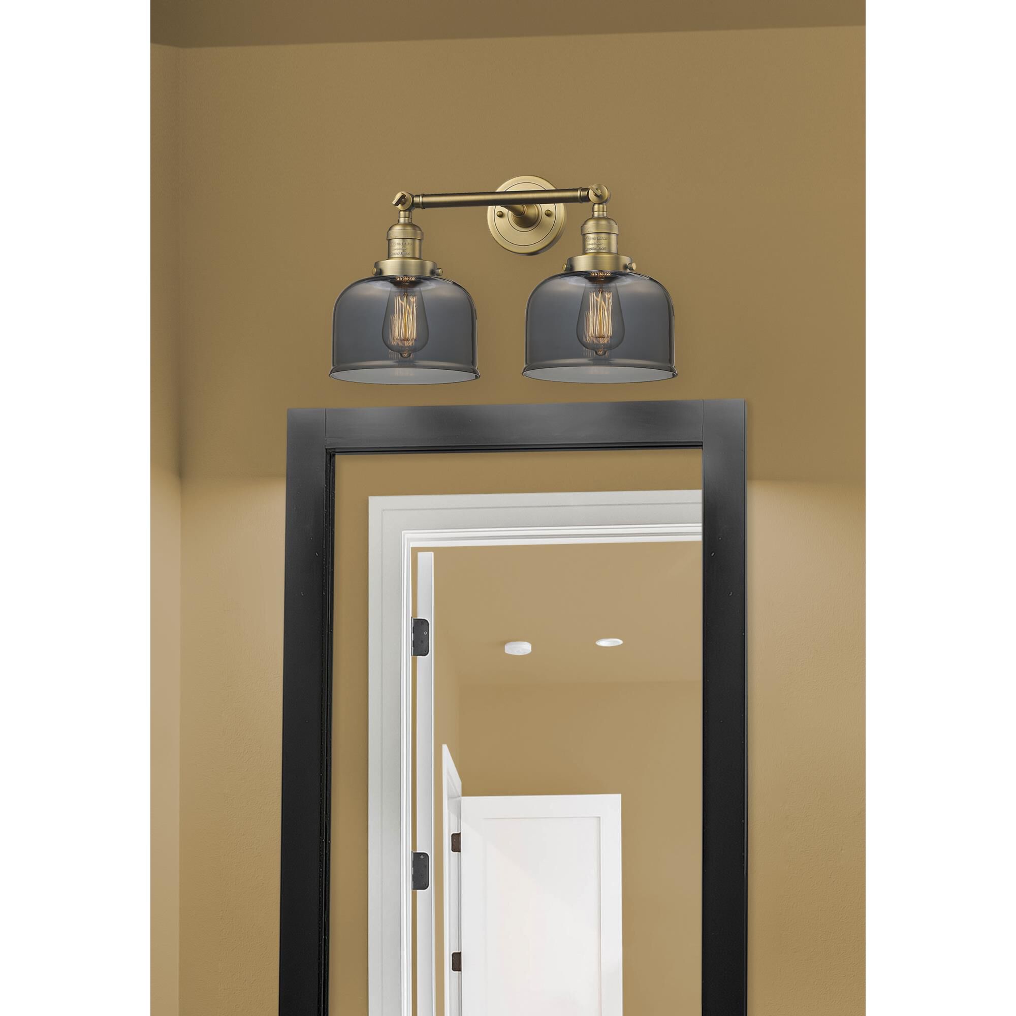 Shown in Brushed Brass finish and Plated Smoked glass