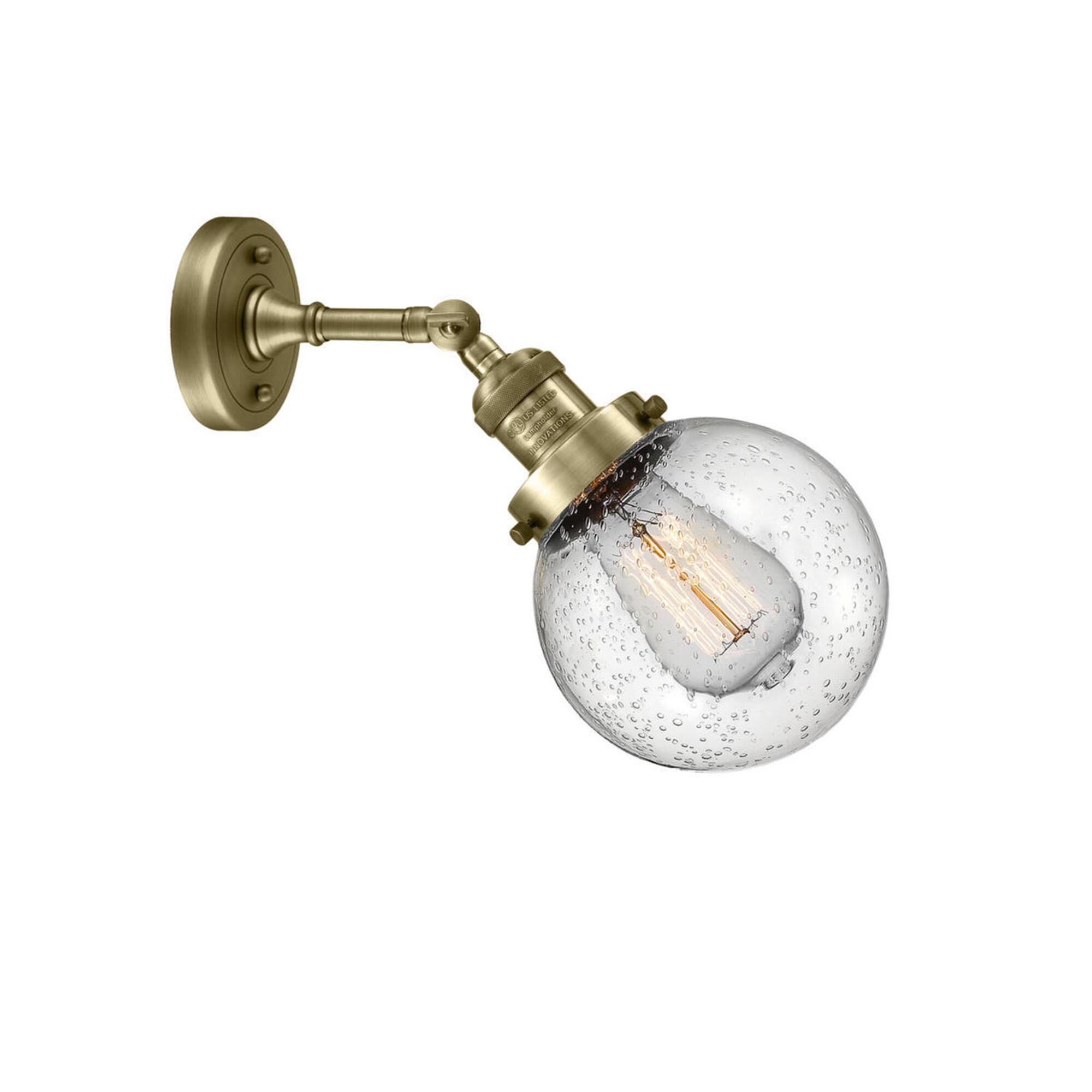 Shown in Antique Brass finish and Seedy glass and No Accent accent