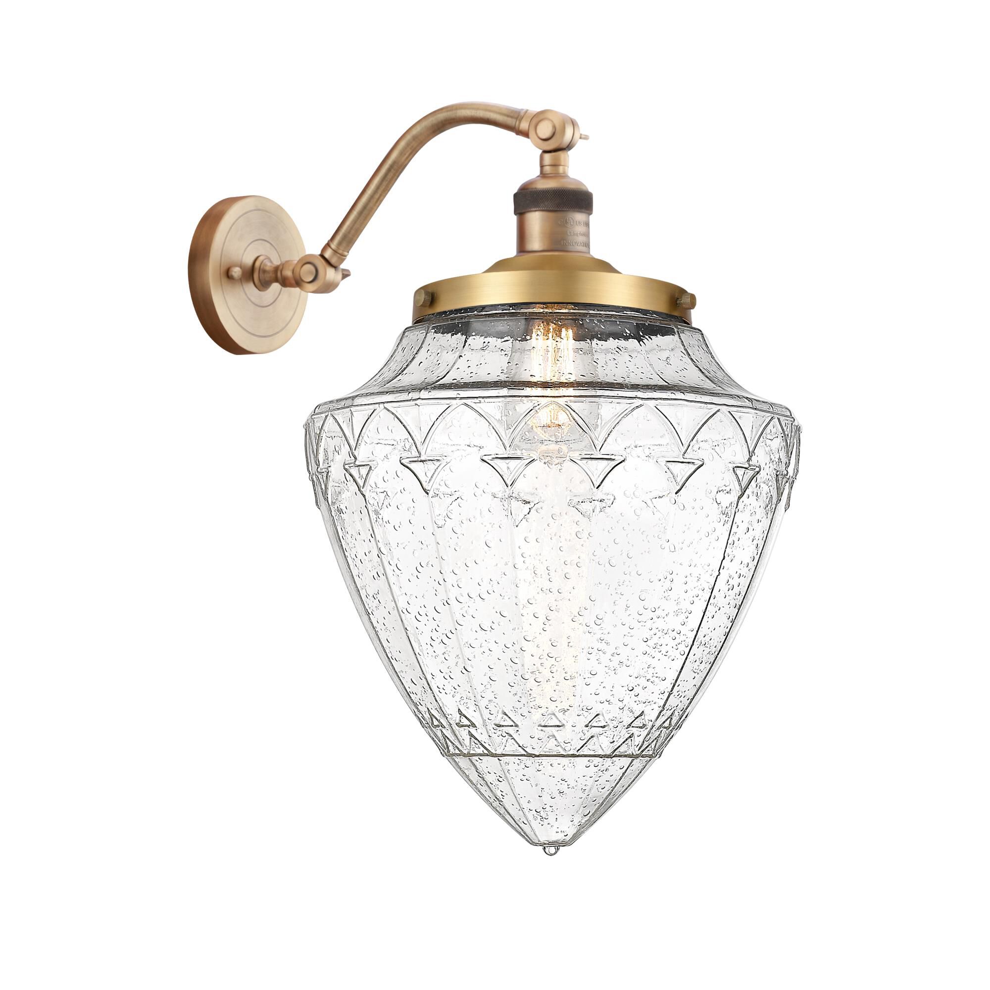 Shown in Brushed Brass finish and Seedy glass