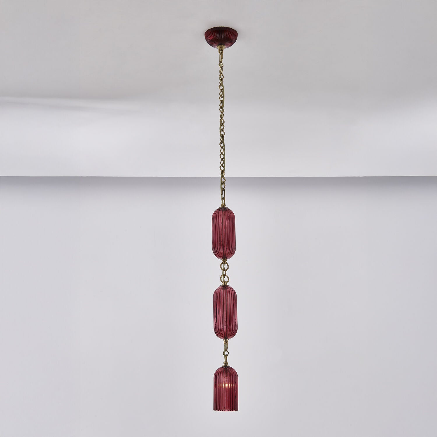 Shown in Satin Brass finish and Peacock Green glass