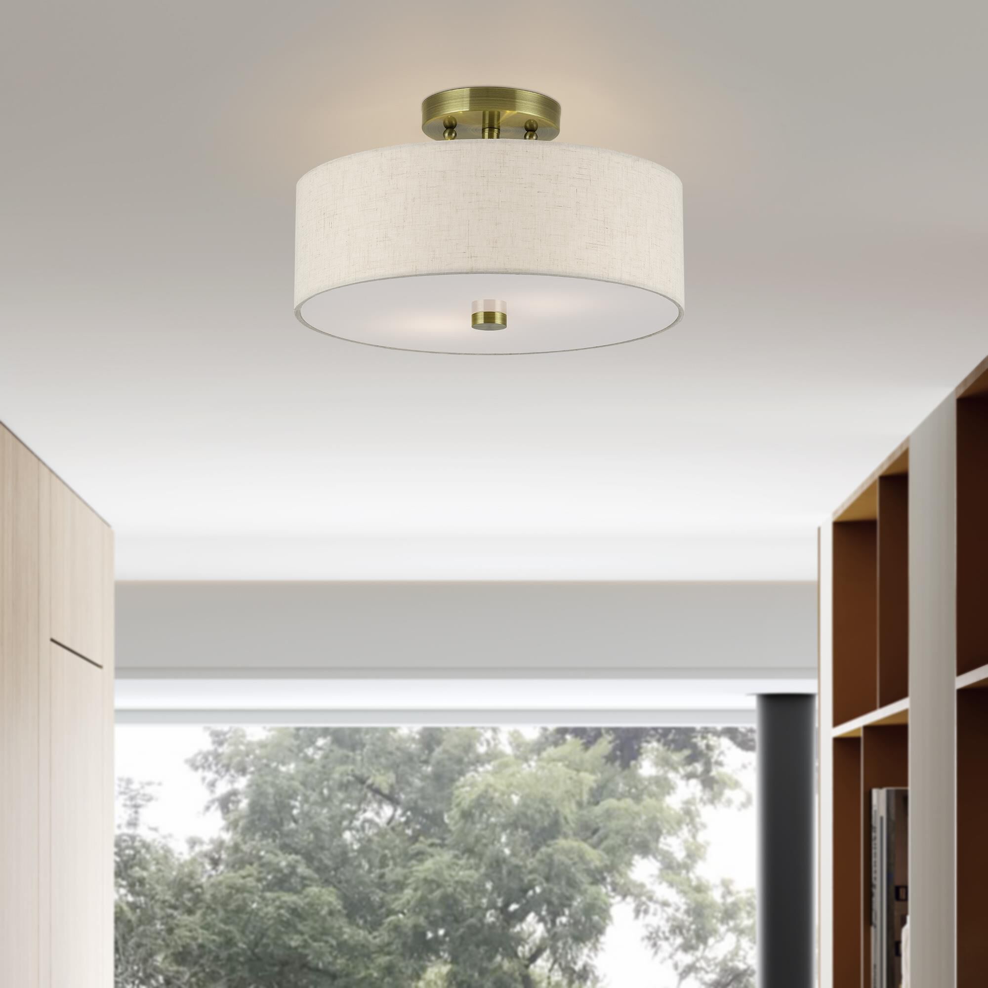 Shown in Antique Brass finish and Hand Crafted Oatmeal Color Fabric with White Color Inside shade