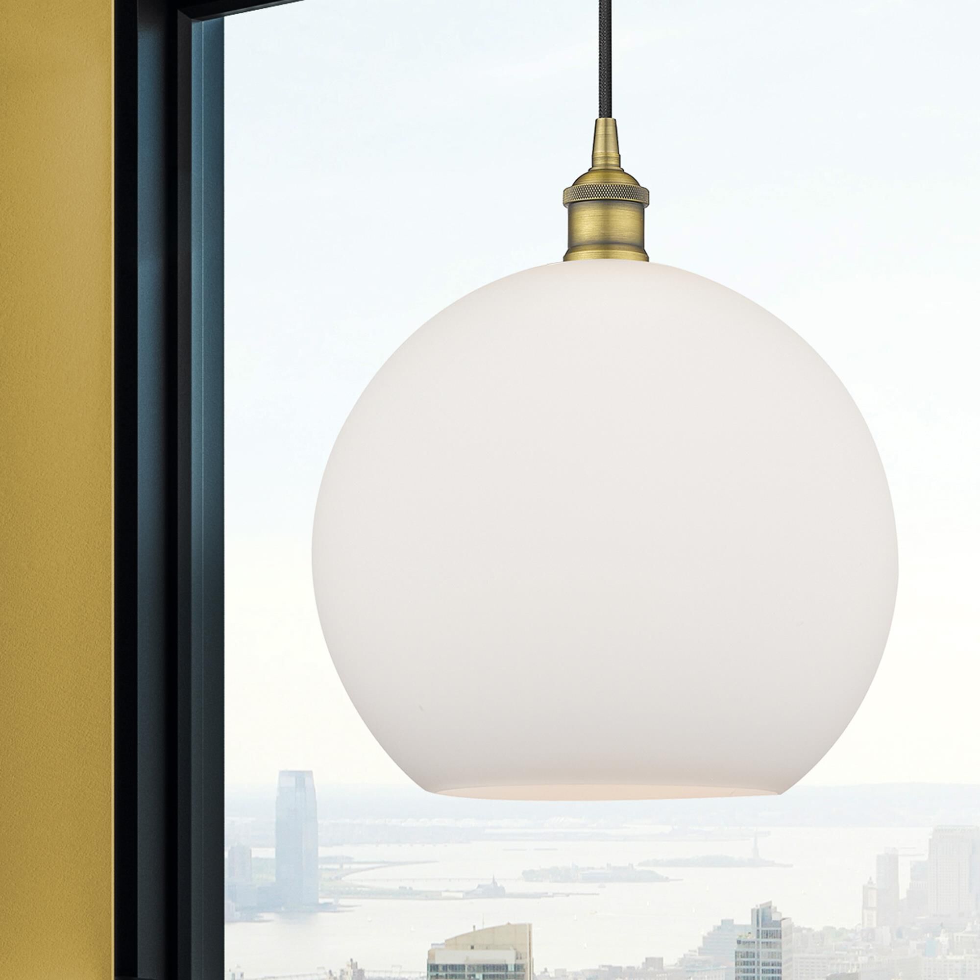 Shown in Brushed Brass finish and Cased Matte White glass