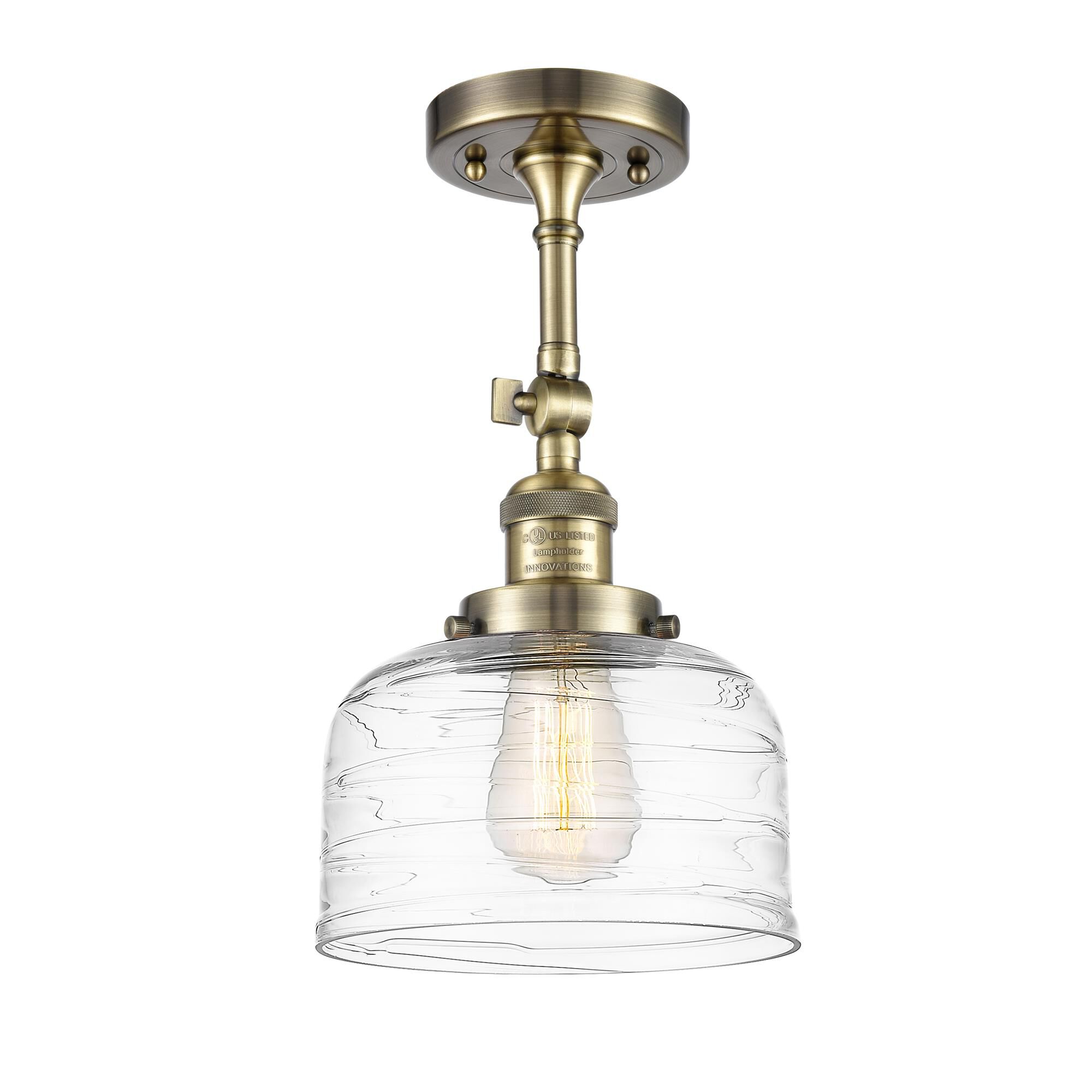 Shown in Antique Brass finish and Clear glass