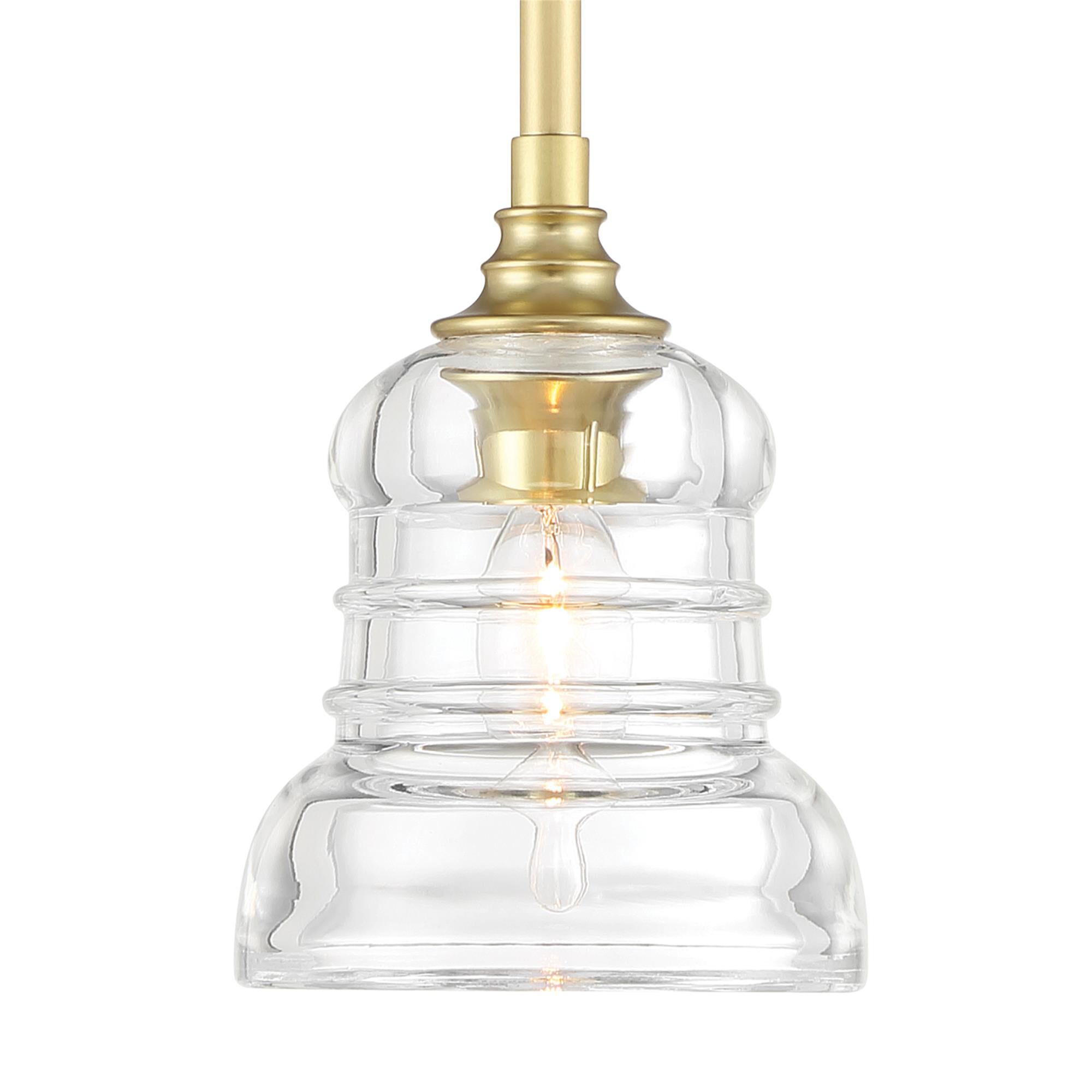 Shown in Aged Brass finish and Clear glass