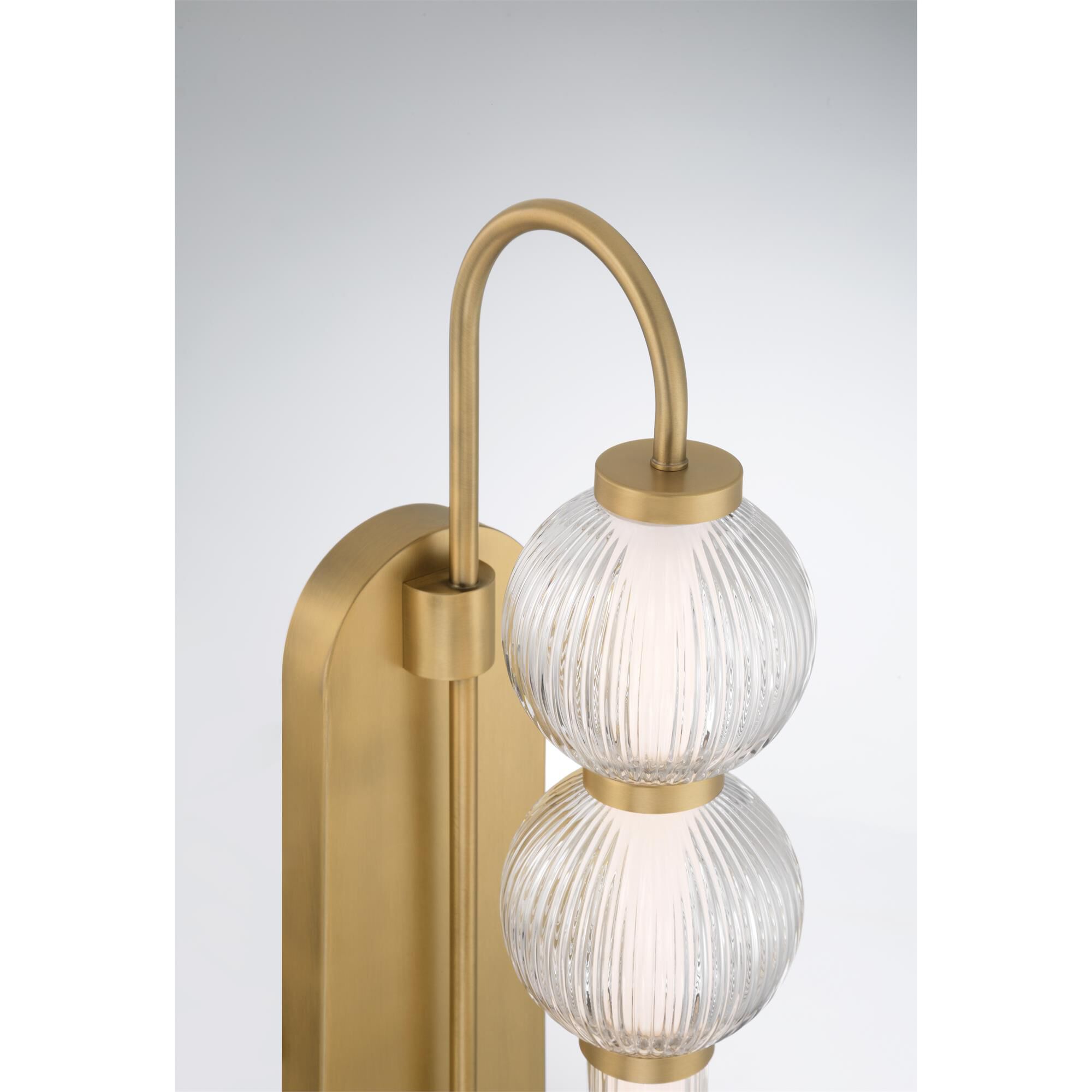 Shown in Legacy Brass finish and Clear Ribbed glass