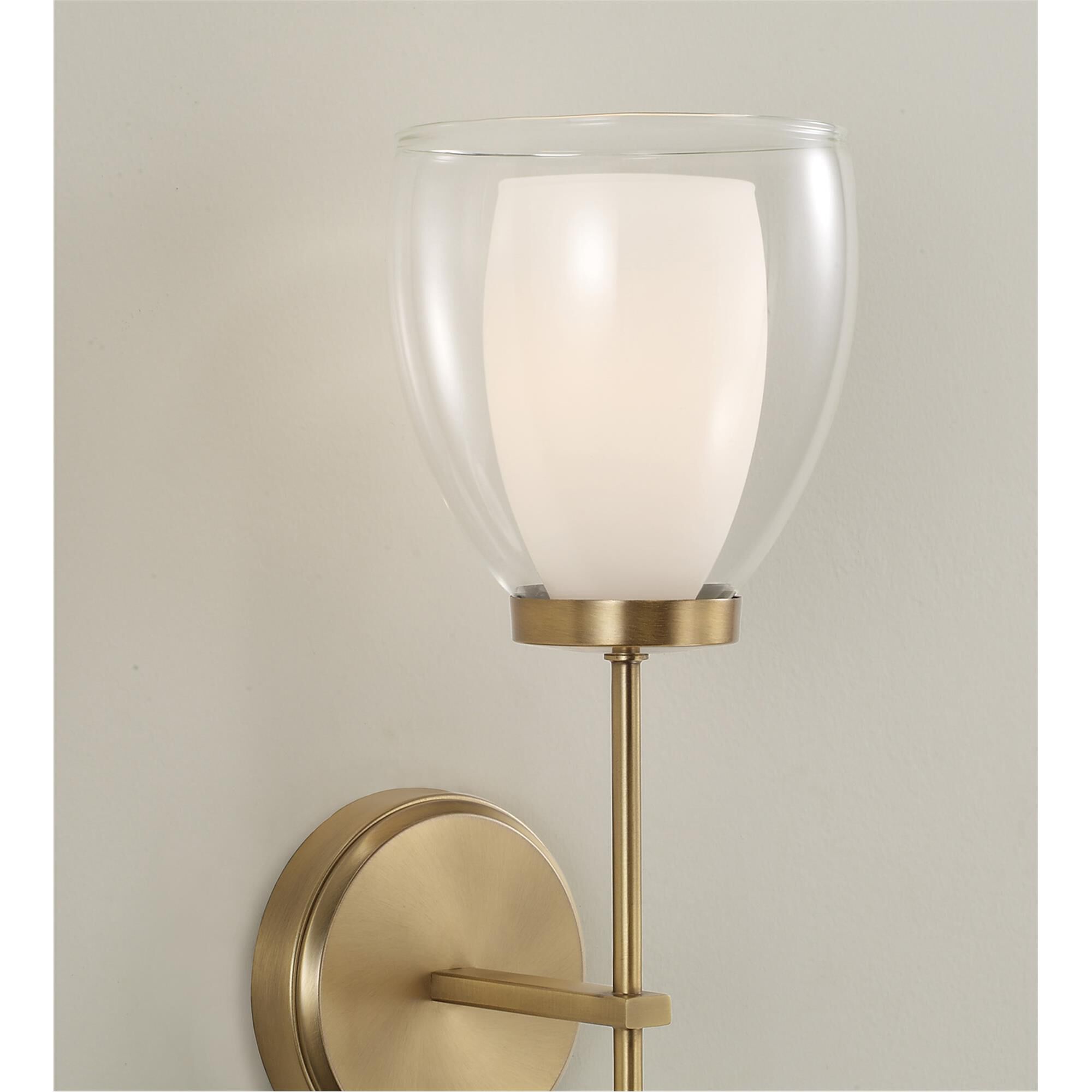 Shown in Aged Brass finish and Layered White And Clear glass