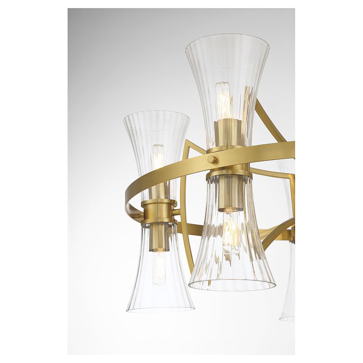 Shown in Warm Brass finish and Clear Ribbed glass