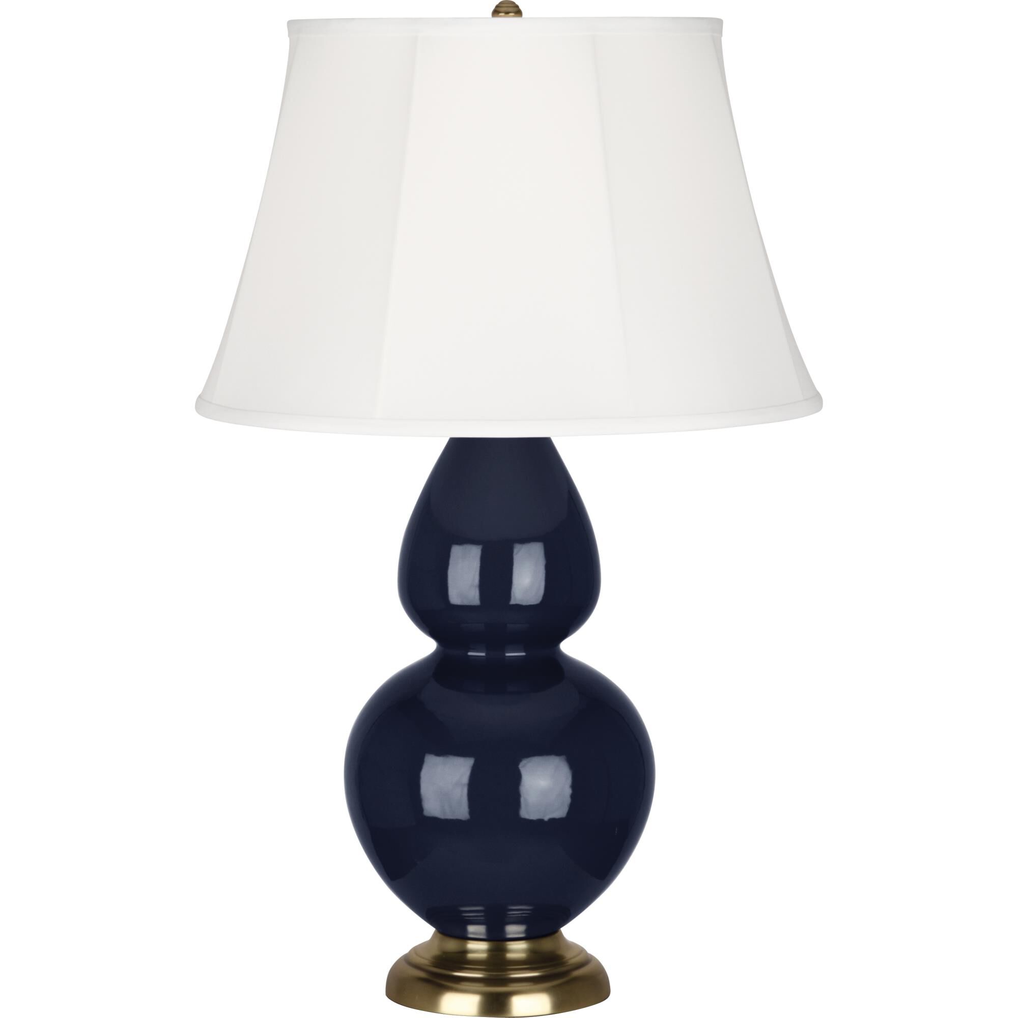 Shown in Midnight Blue Glazed Ceramic With Antique Brass ed Accents finish and Ivory Stretched Fabric shade