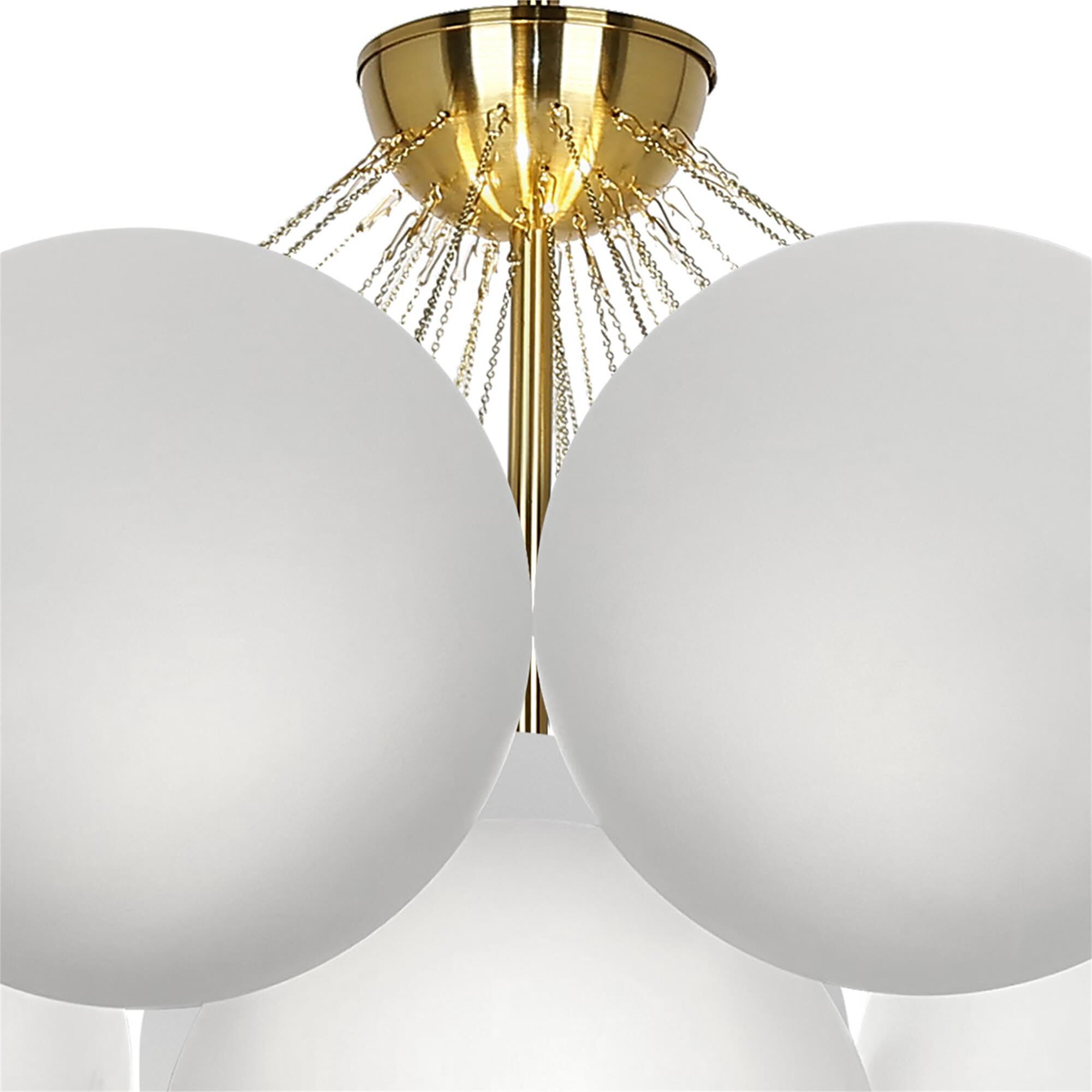 Shown in White and Aged Brass finish and White Globe glass