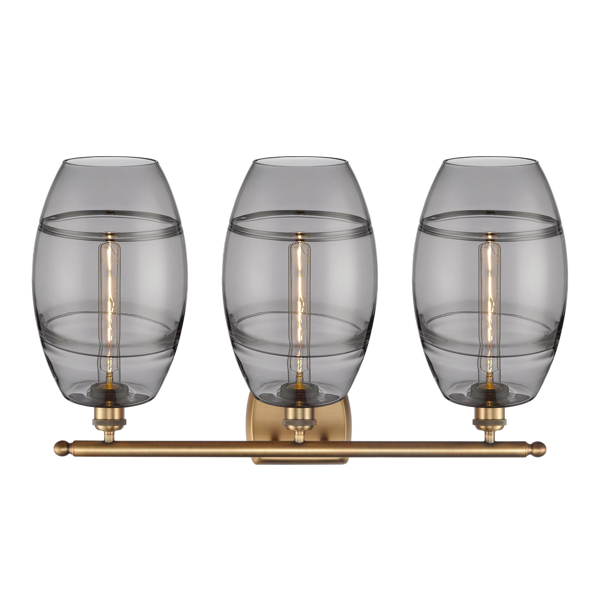 Shown in Brushed Brass finish and Light Smoke glass