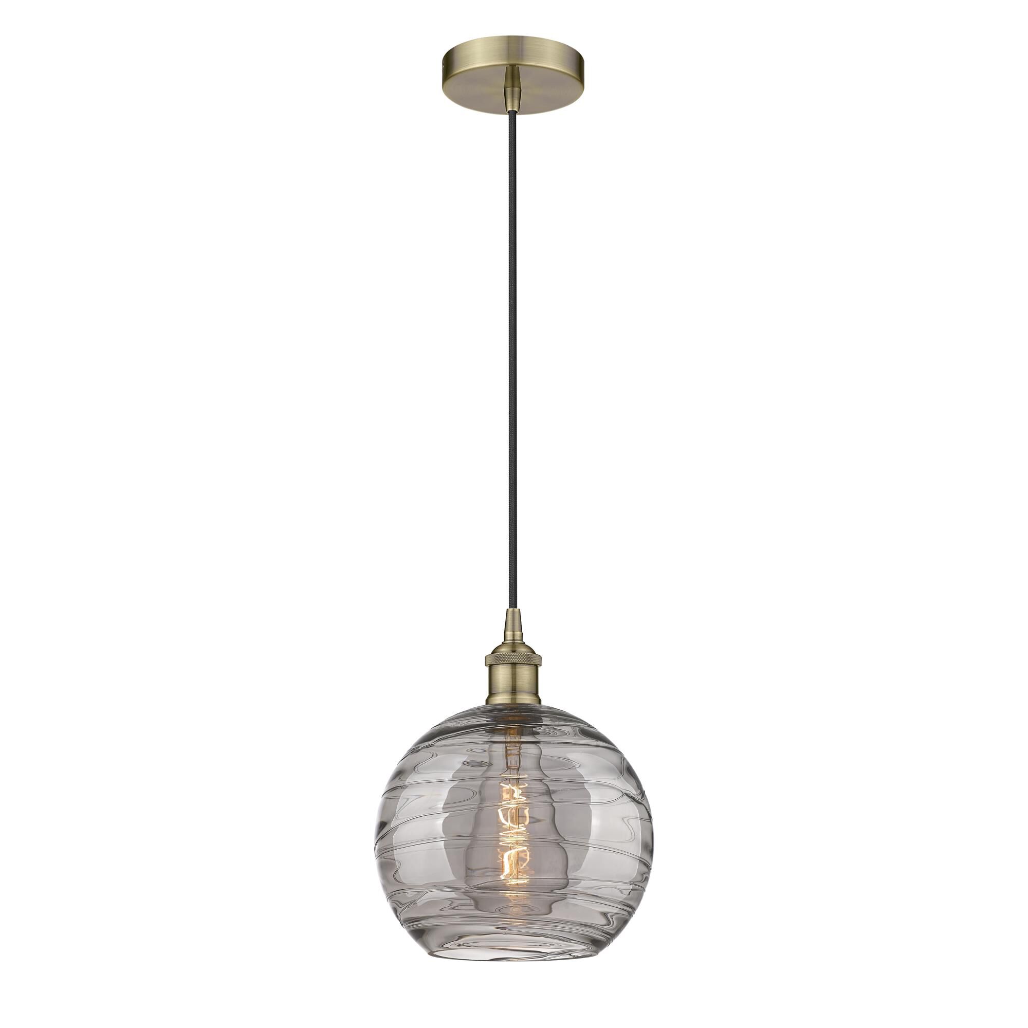Shown in Antique Brass finish and Light Smoke Deco Swirl glass