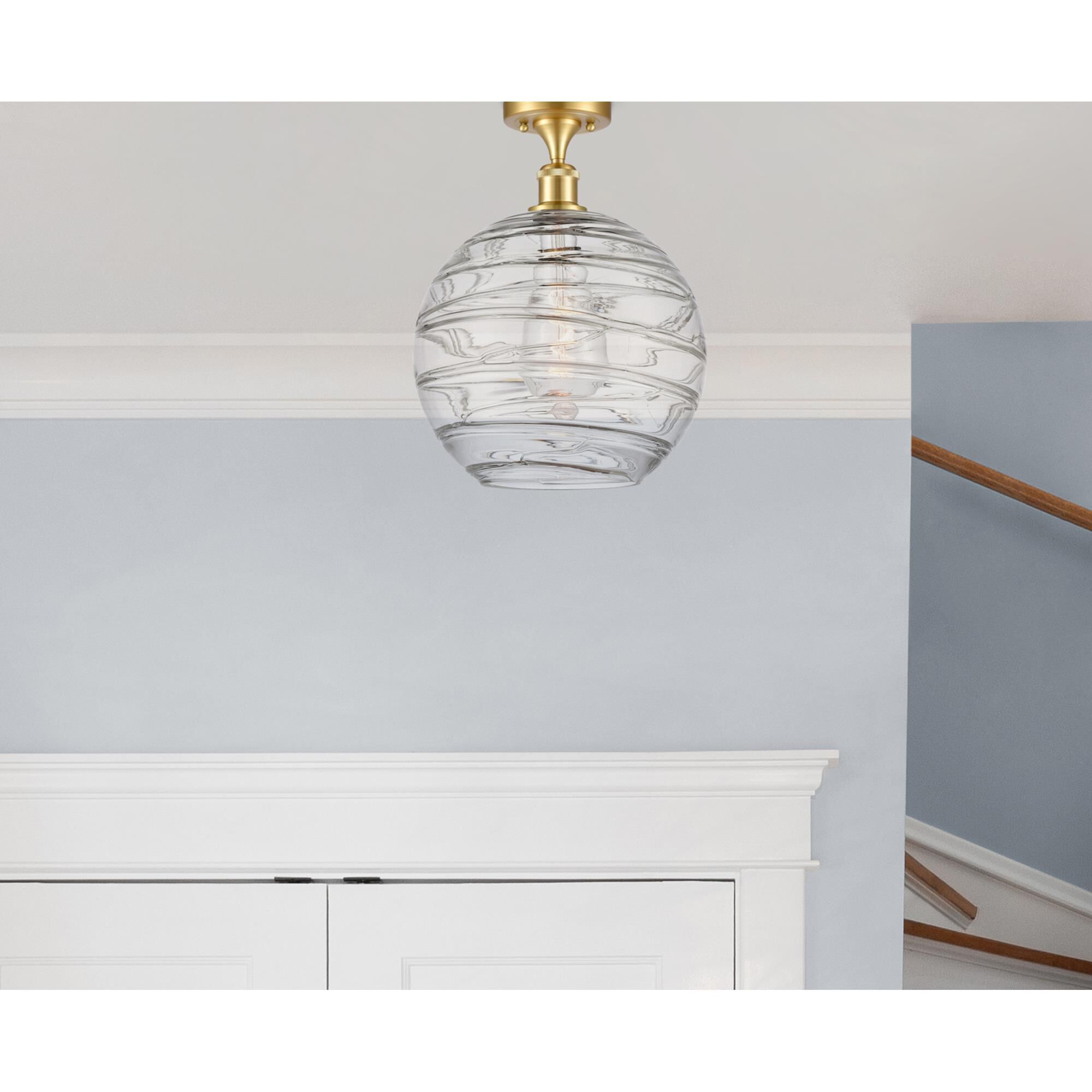 Shown in Satin Gold finish and Clear X-Large Deco Swirl glass and Polished Chrome accent