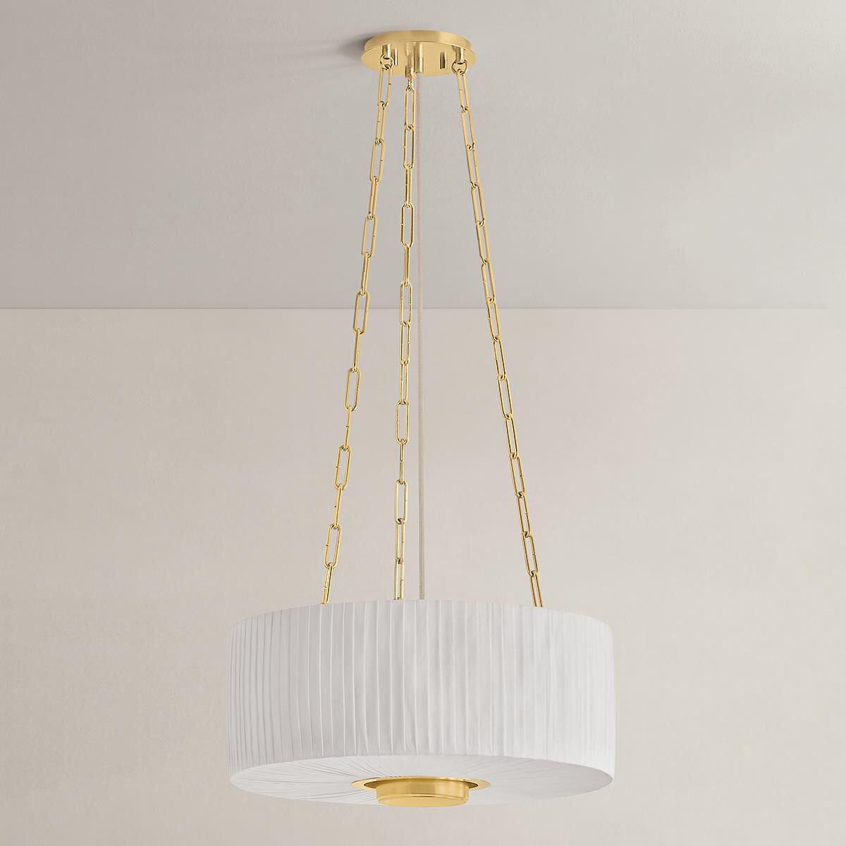 Shown in Aged Brass finish and Ivory Linen shade