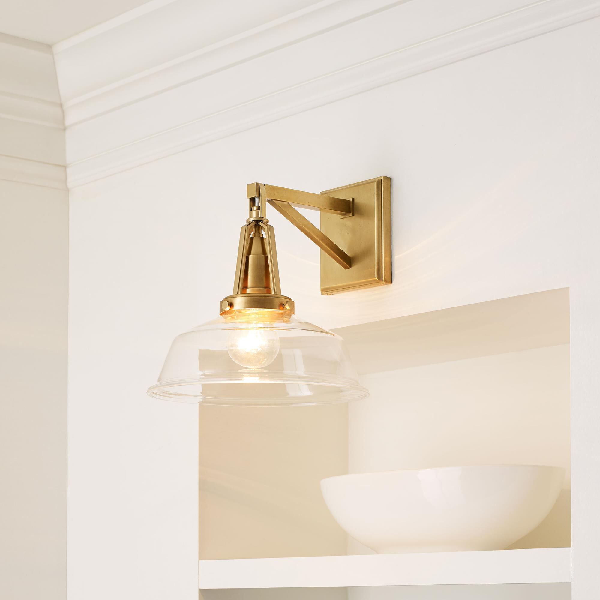 Shown in Antique-Burnished Brass finish and Clear Glass shade