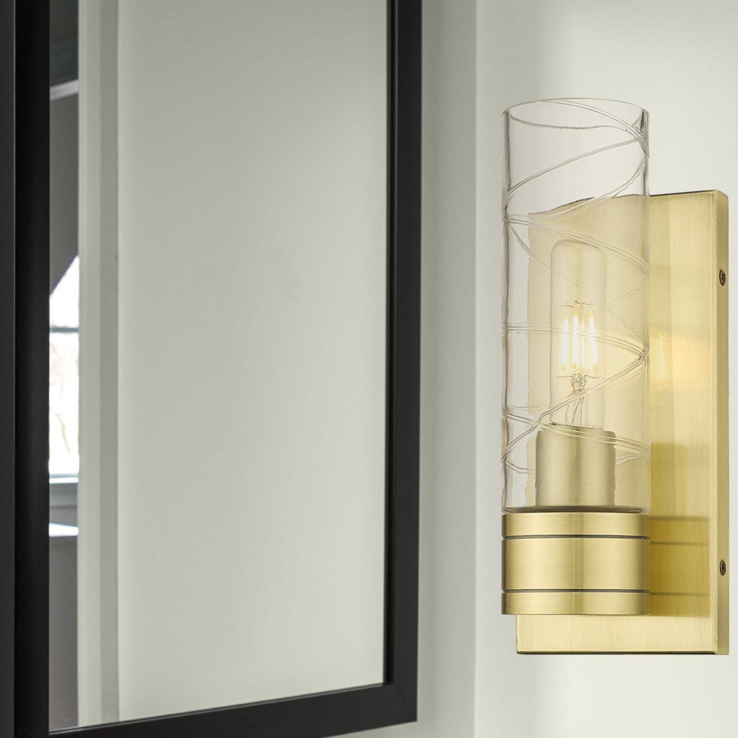 Shown in Antique Brass finish and Deco Swirl glass