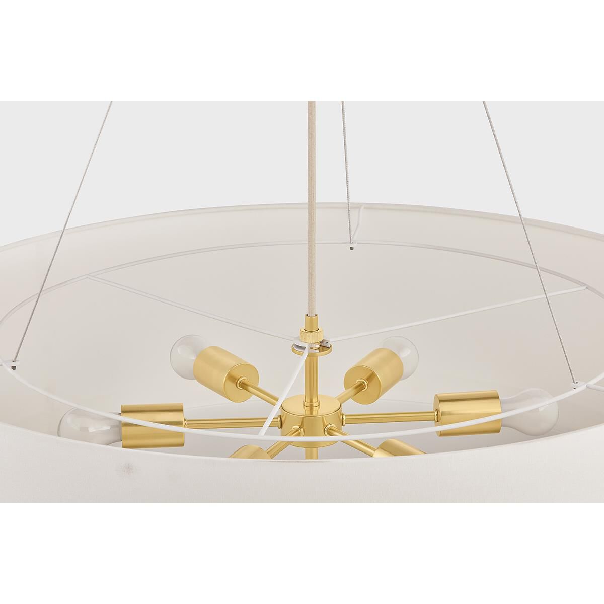 Shown in Aged Brass finish and White Linen shade