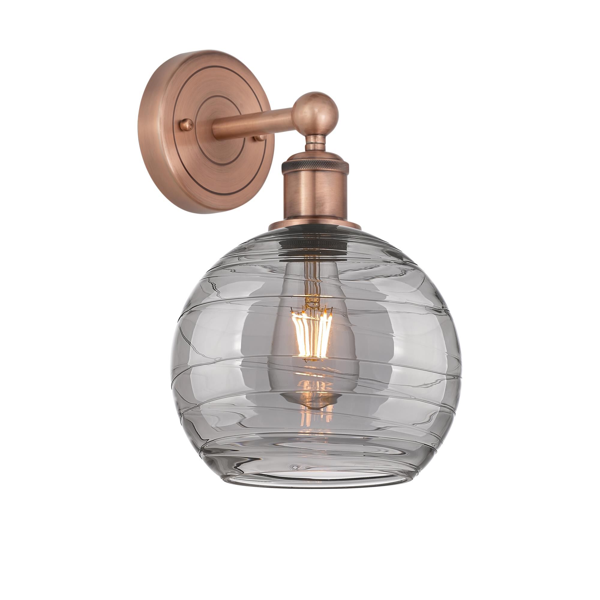 Shown in Antique Copper finish and Light Smoke Deco Swirl glass