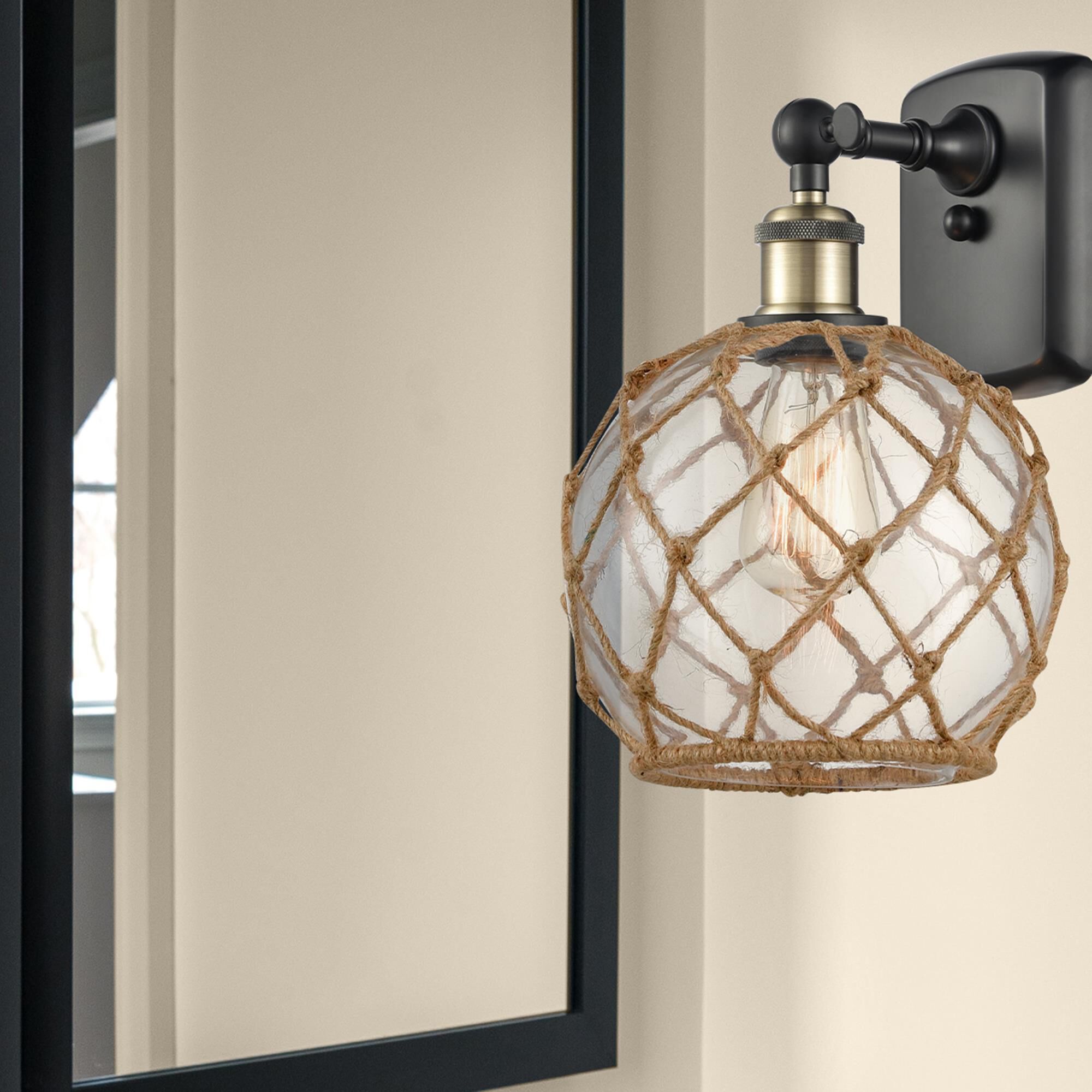Shown in Black Antique Brass finish and Sphere glass and Glass And Rope shade