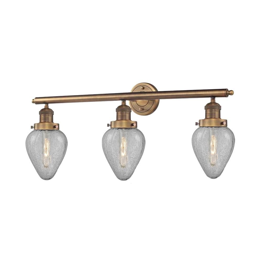 Shown in Brushed Brass finish and Clear Crackle glass