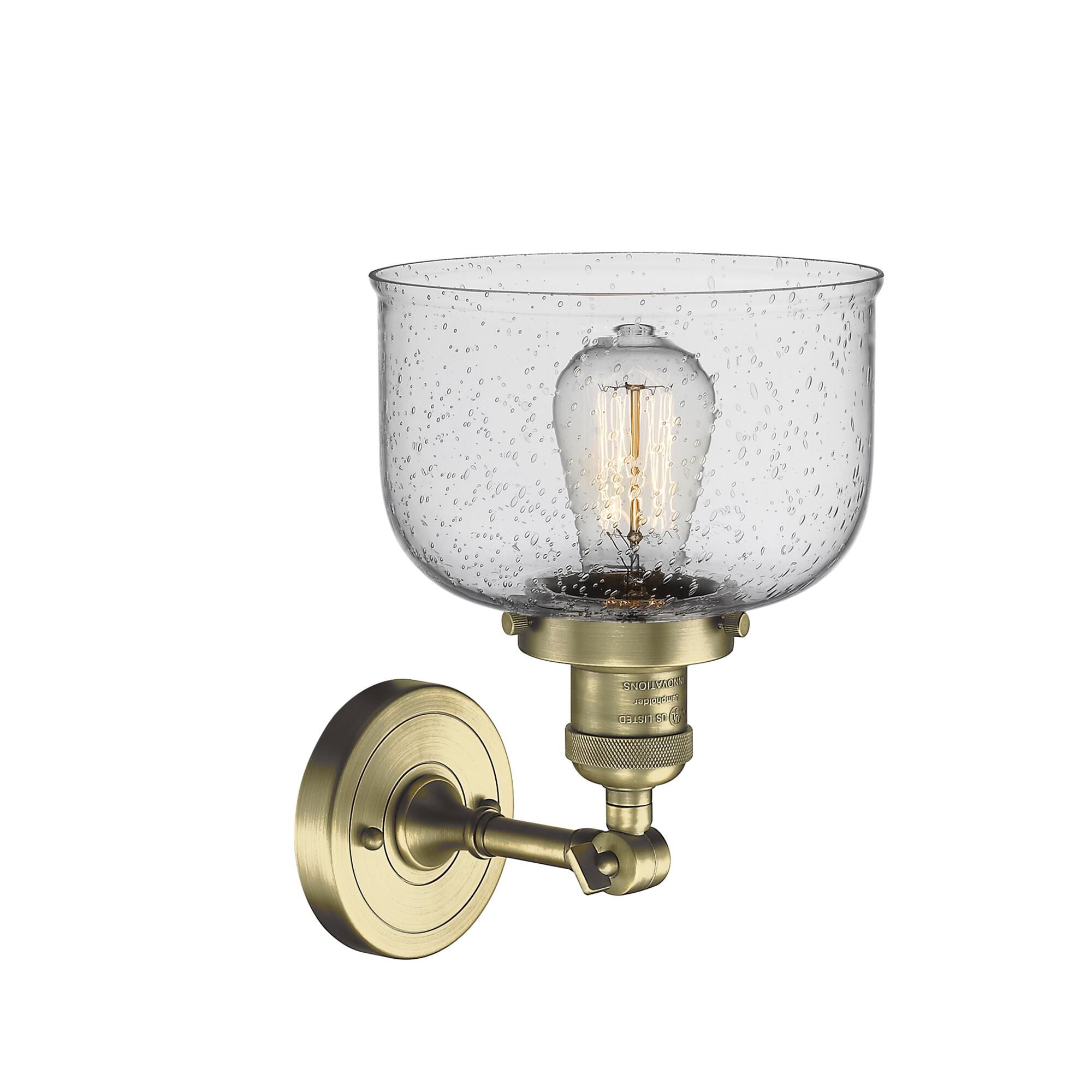 Shown in Antique Brass finish and Seedy glass