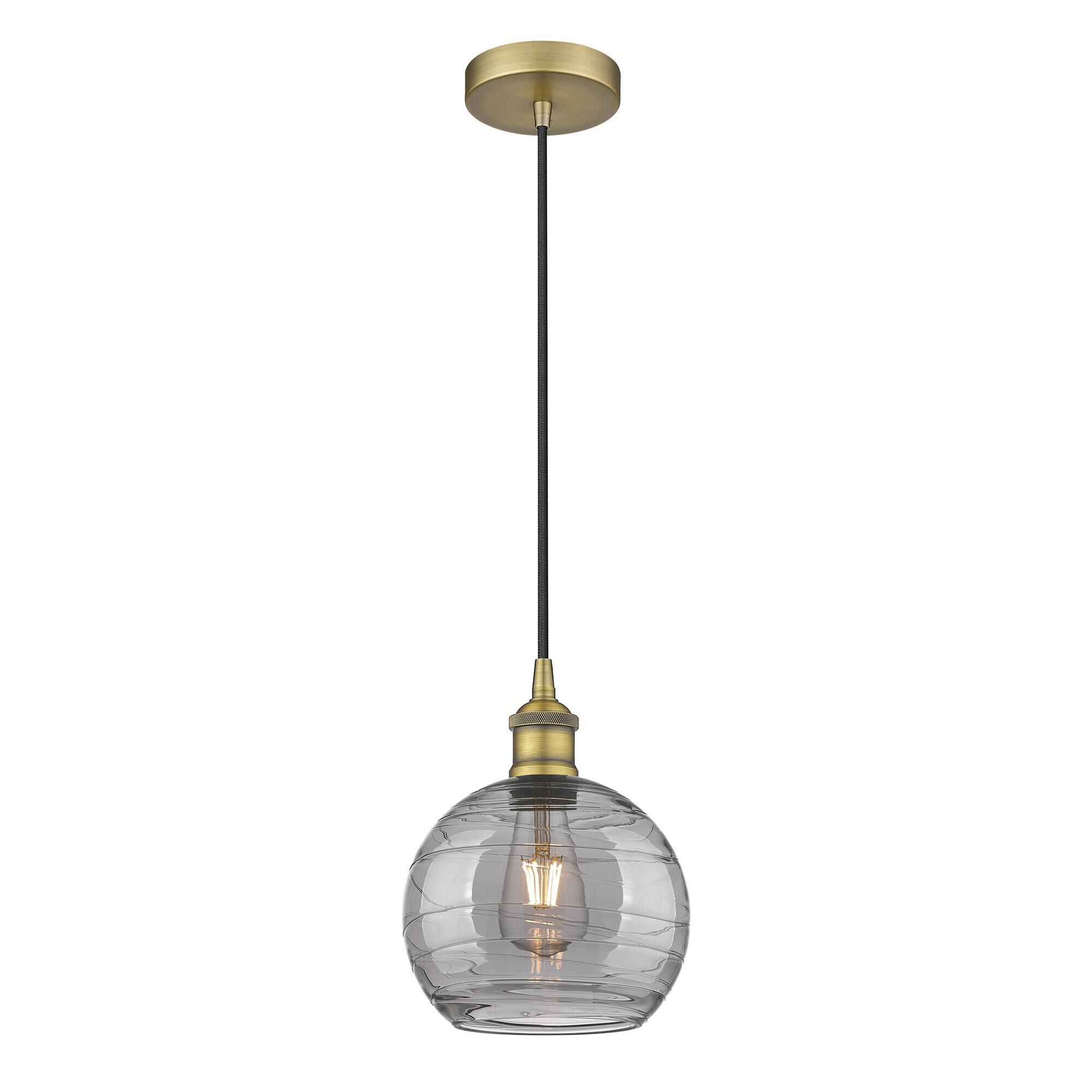 Shown in Brushed Brass finish and Light Smoke Deco Swirl glass