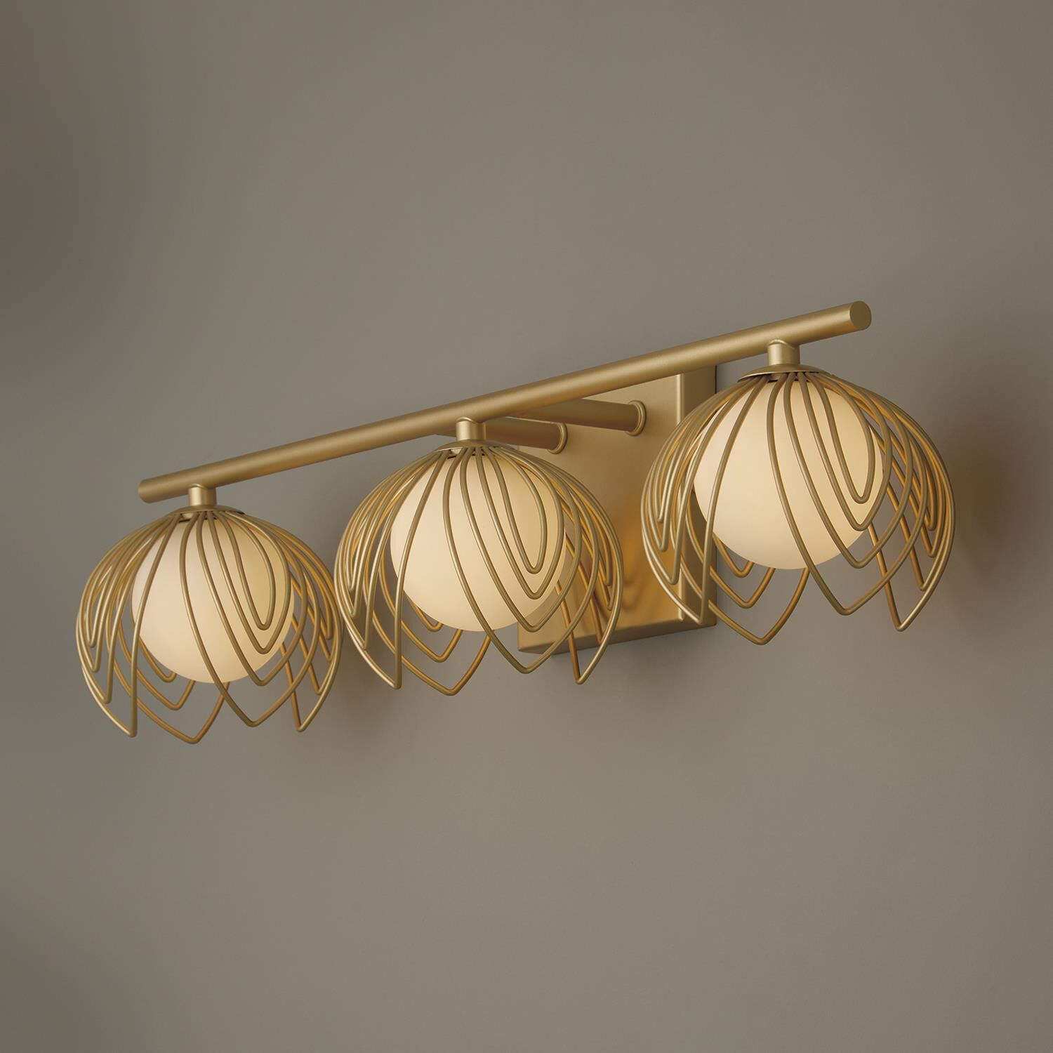 Shown in Buffed Gold finish and Soft White  Globes glass