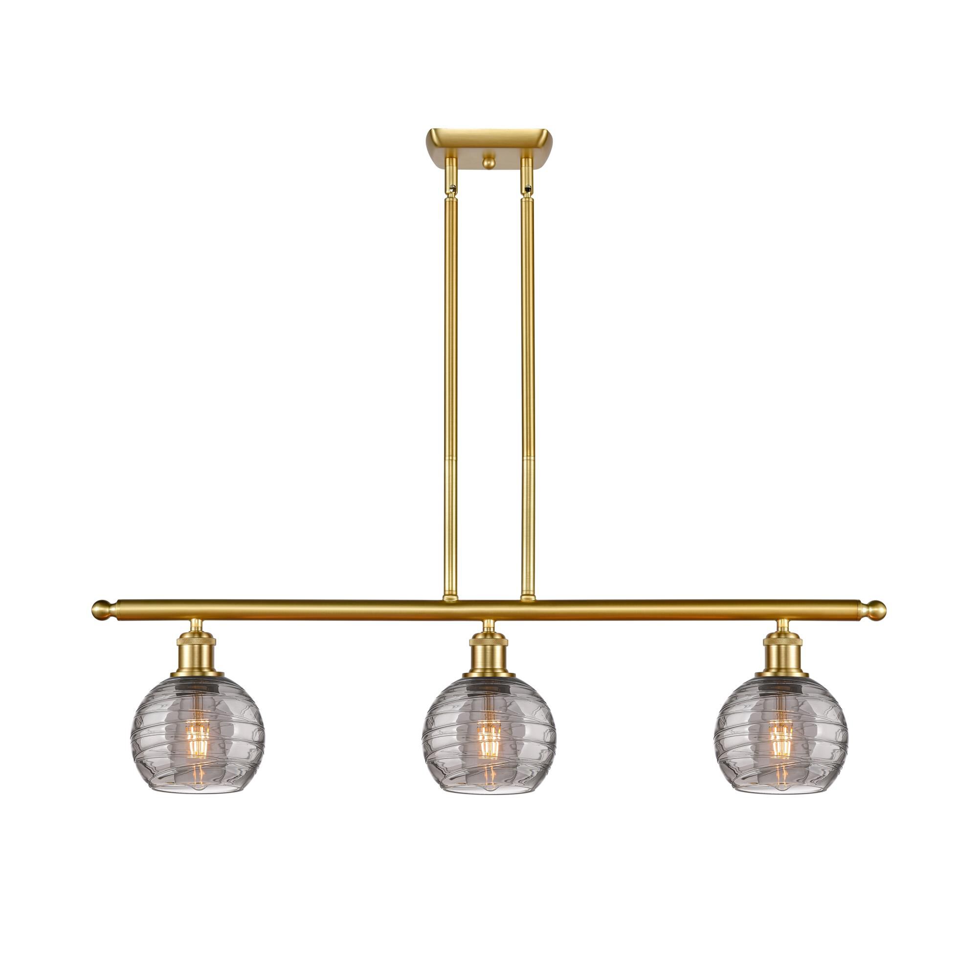Shown in Satin Gold finish and Light Smoke Deco Swirl glass