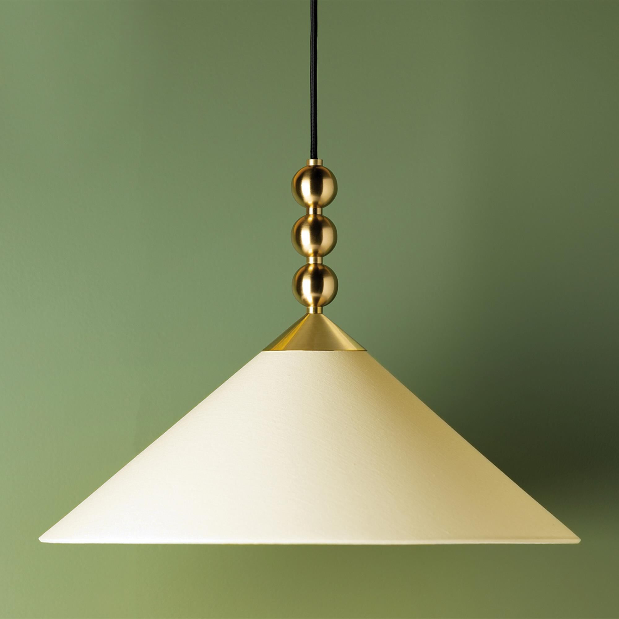 Shown in Aged Brass finish and White Linen shade