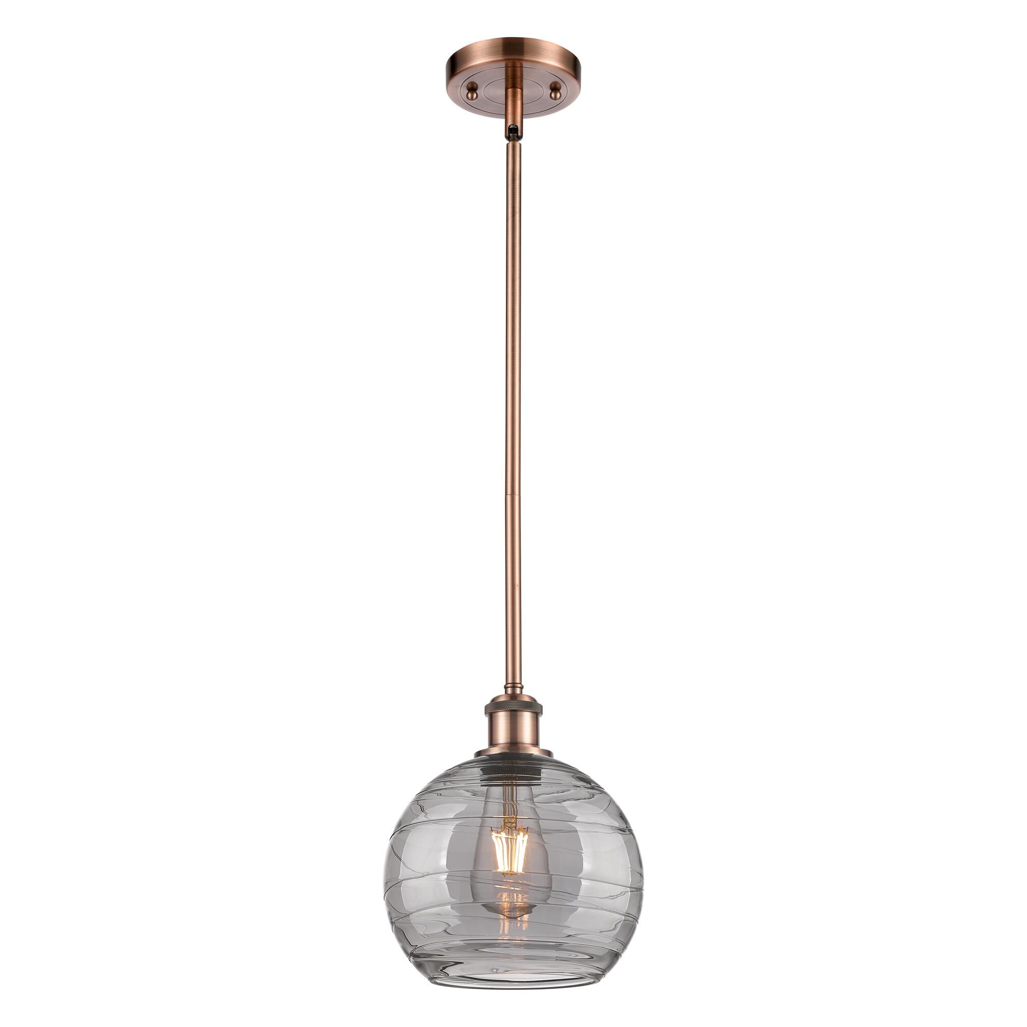 Shown in Antique Copper finish and Light Smoke Deco Swirl glass