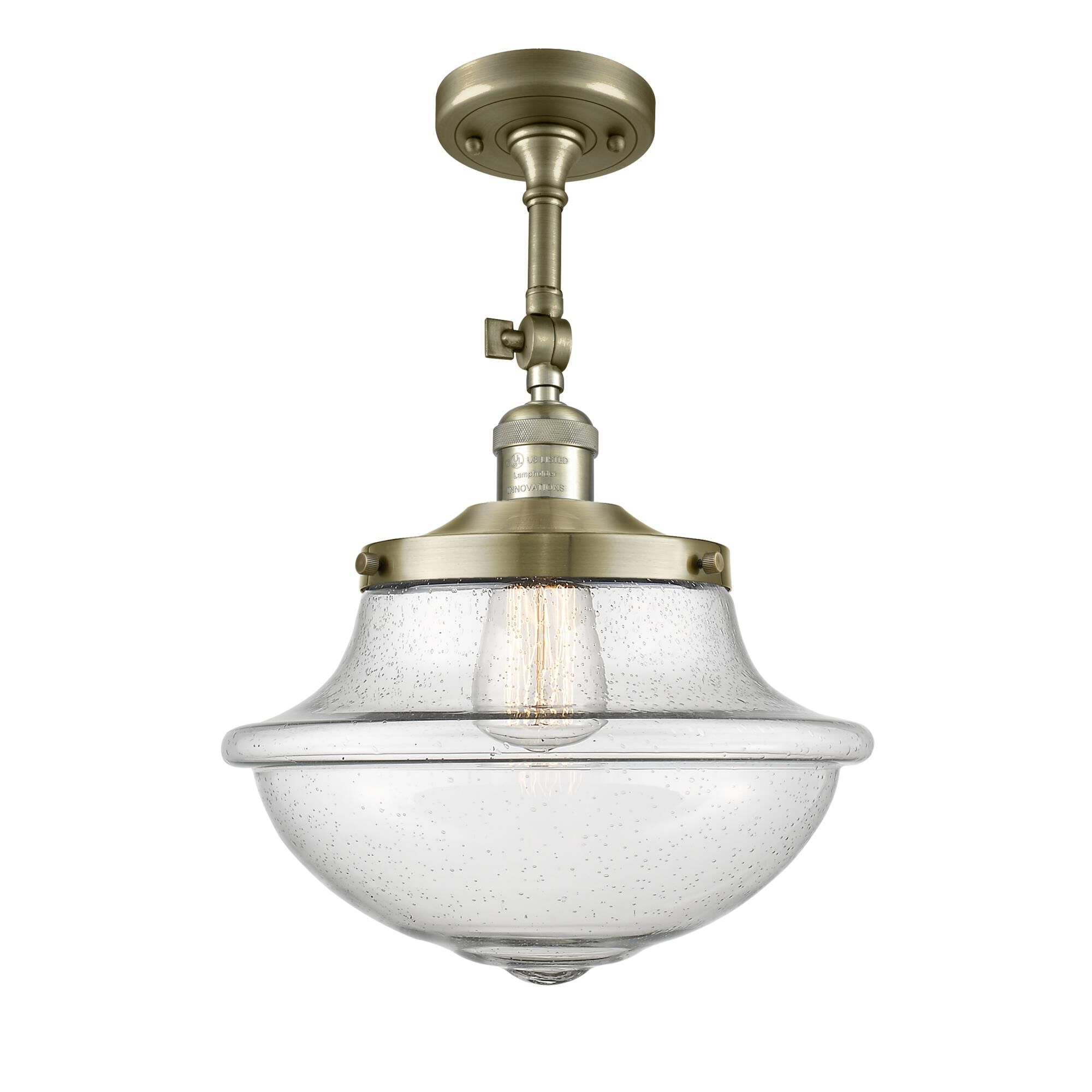 Shown in Antique Brass finish and Schoolhouse glass and Glass shade