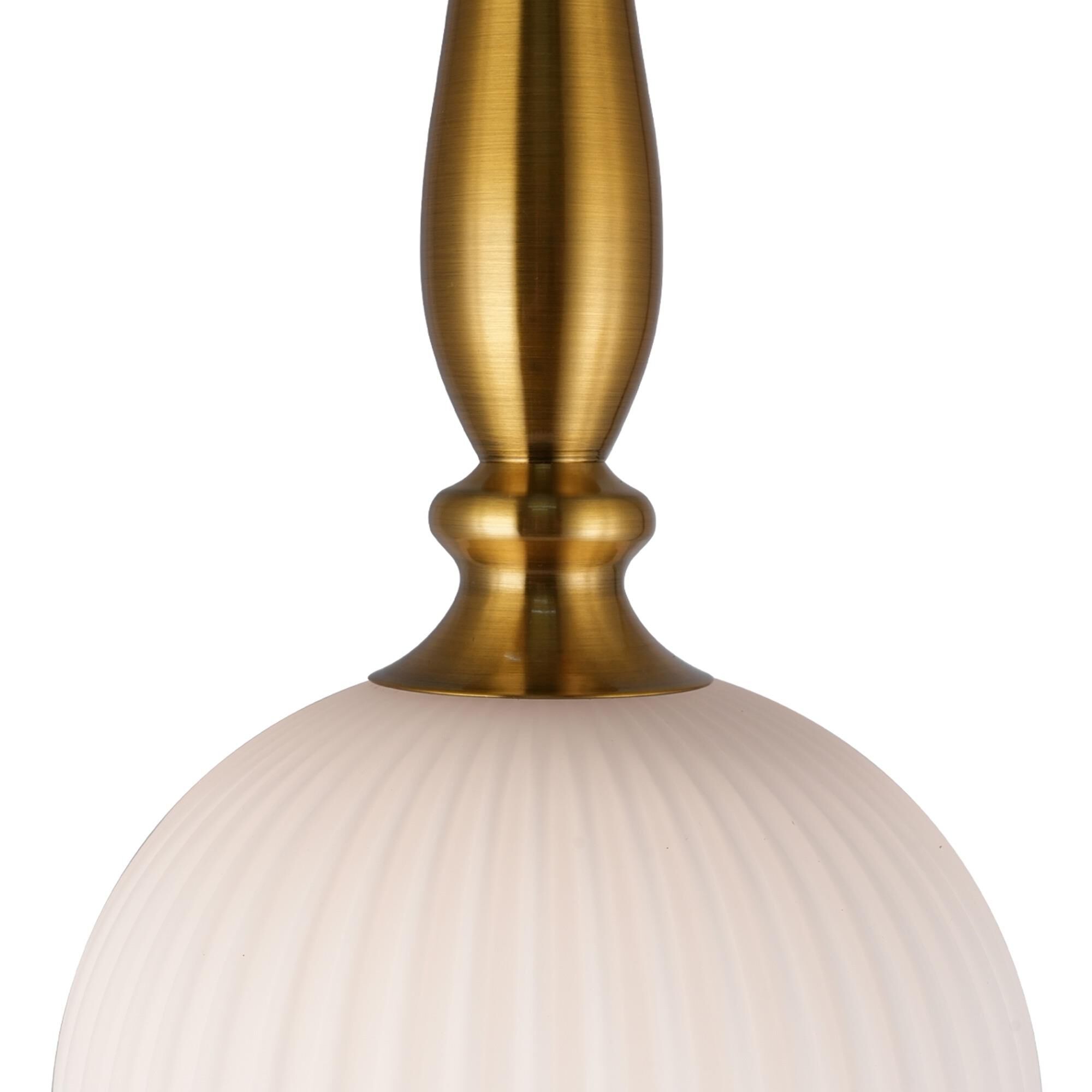 Shown in Brushed Brass finish and Ribbed glass
