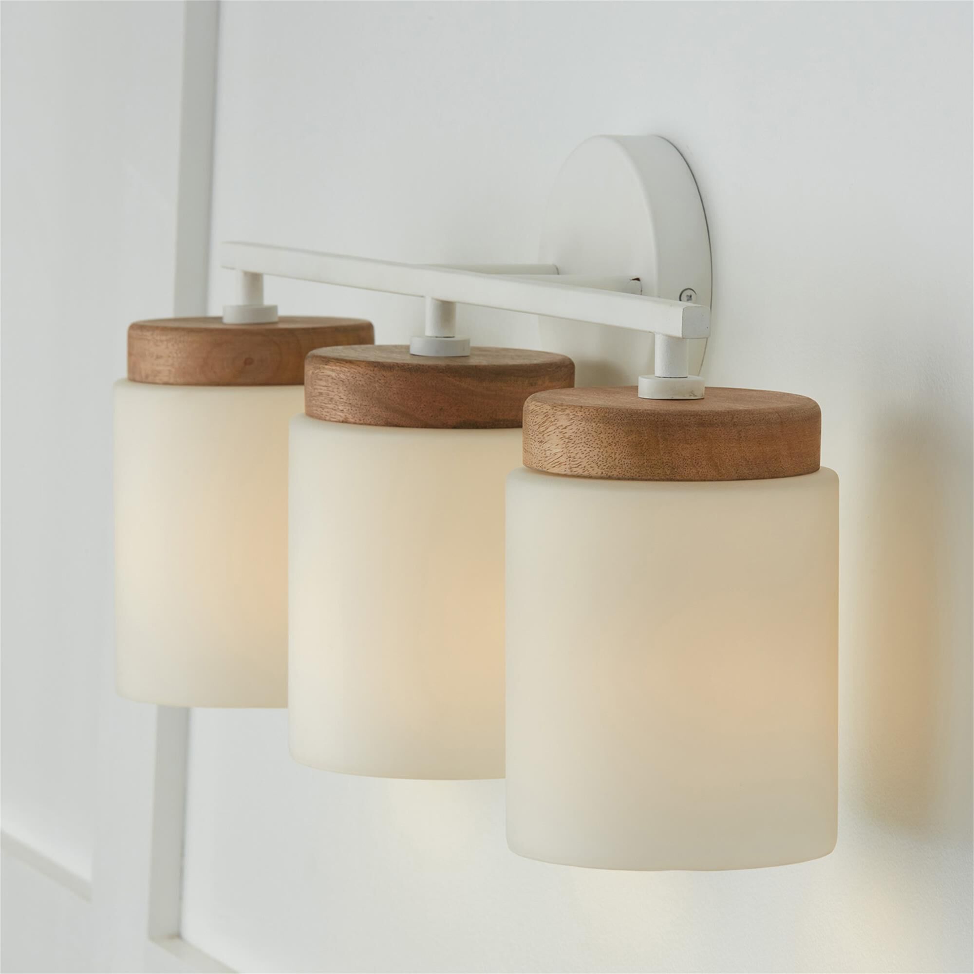 Shown in Light Wood And White finish and Soft White glass