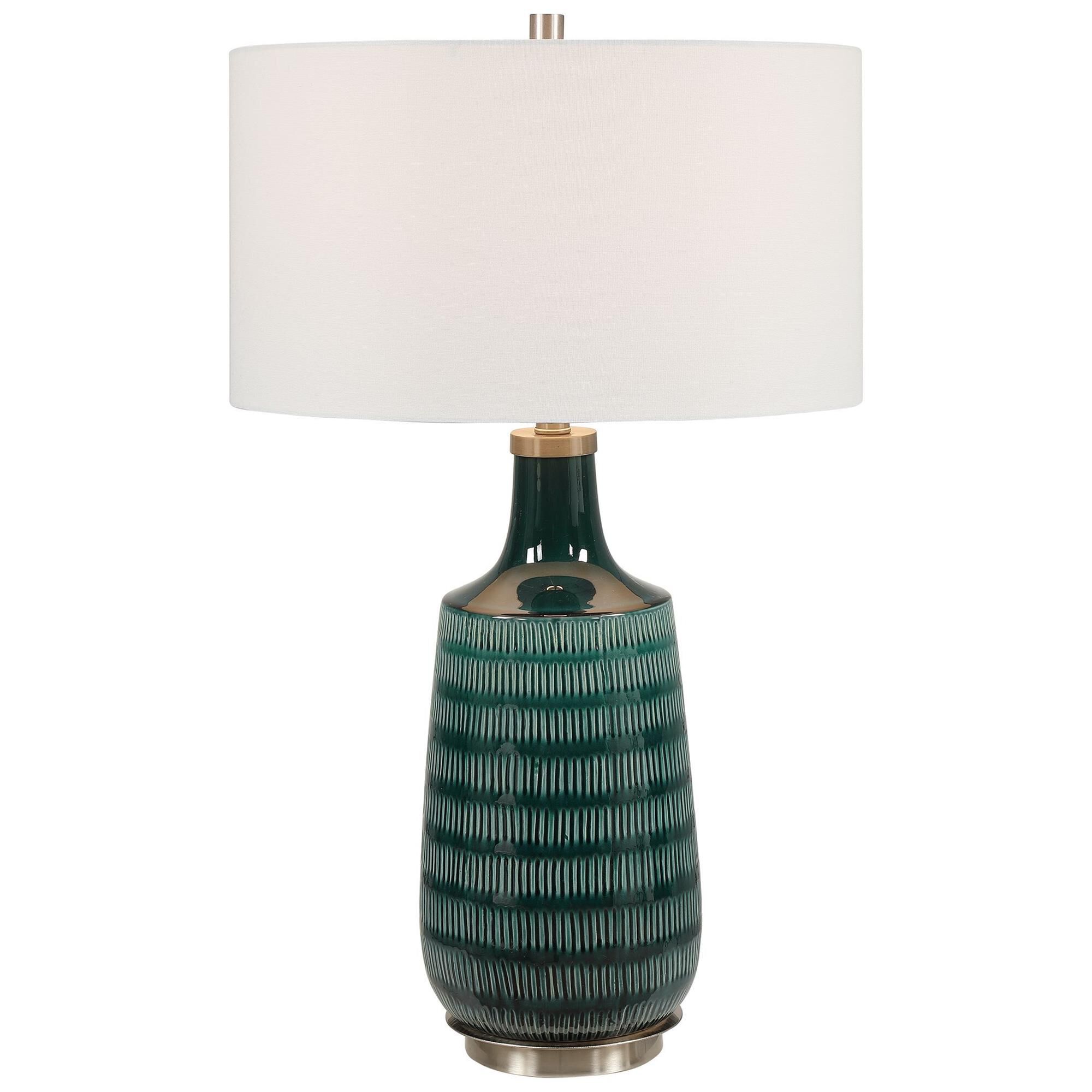 Shown in Finished In A Stunning Deep Teal Glaze, This Ceramic Table Lamp Features Hand Carved Organic Vertica finish and Round Drum Hardback shade