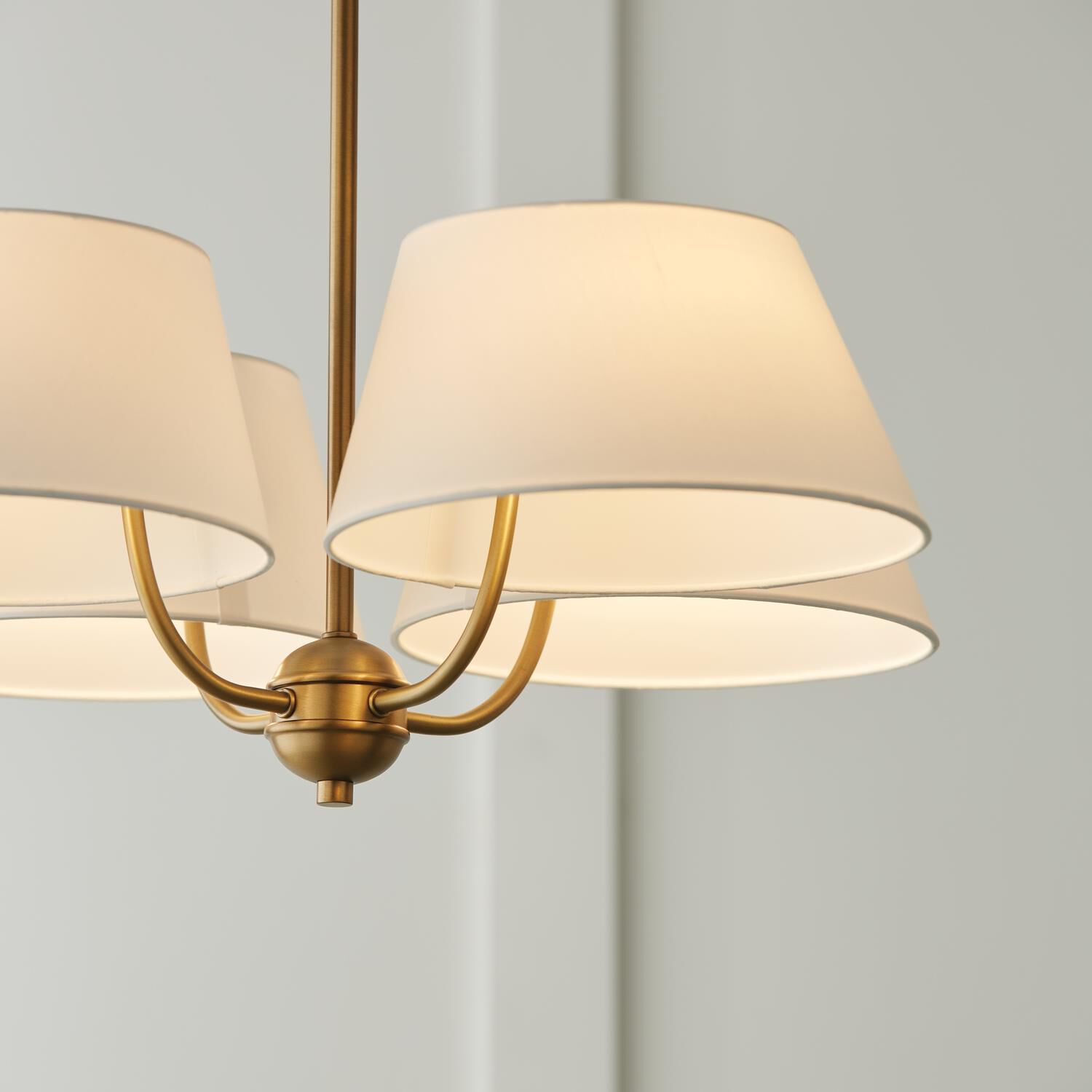 Shown in Aged Brass finish and White Fabric shade