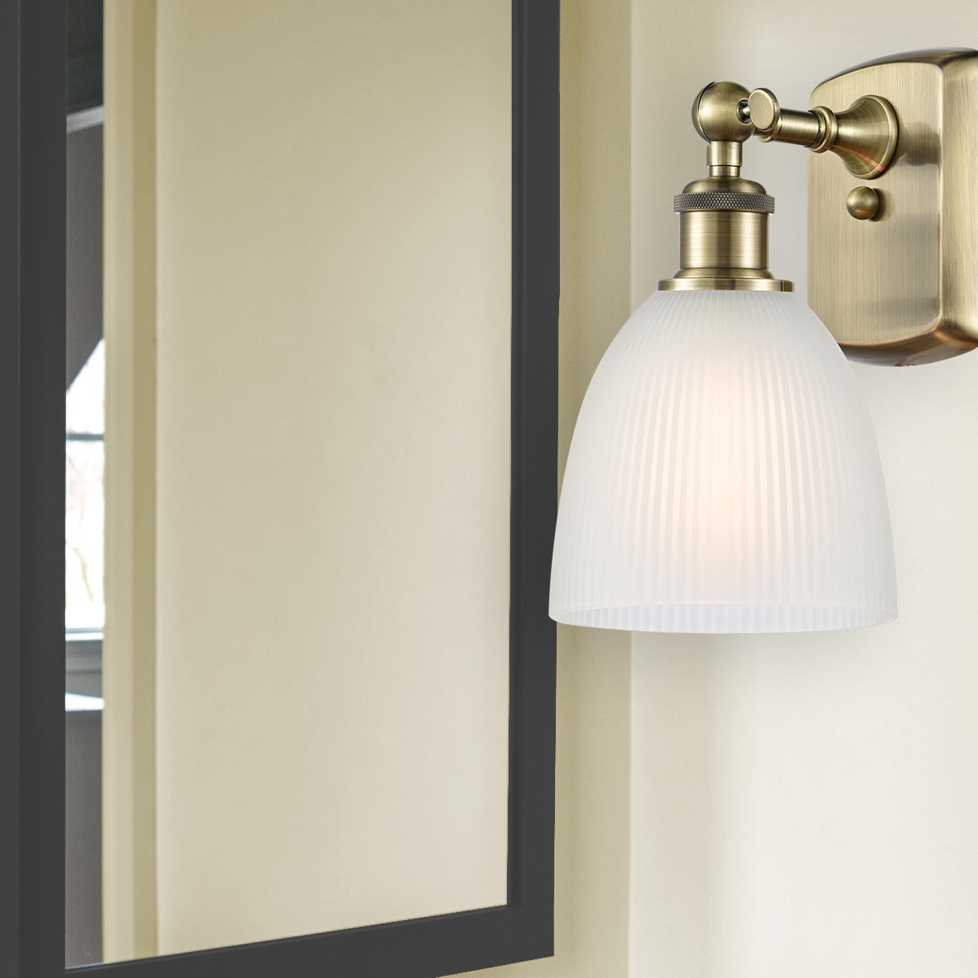 Shown in Antique Brass finish and White Castile glass and None shade