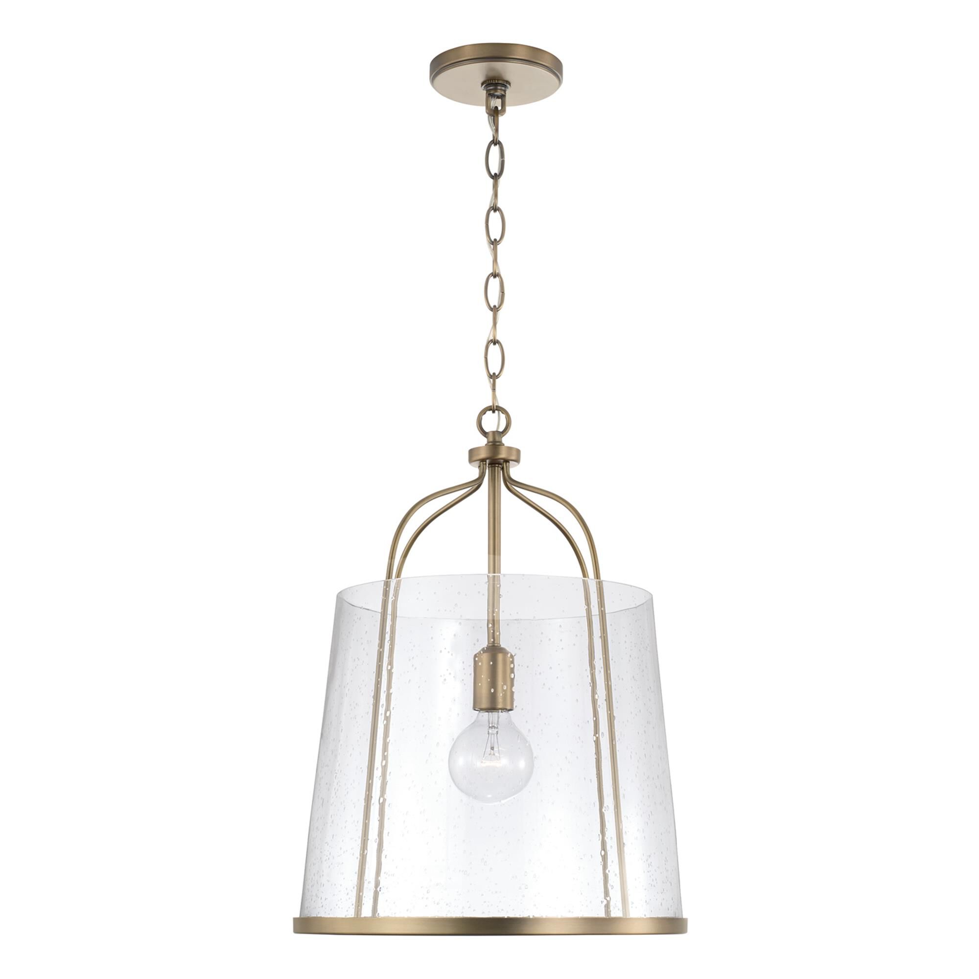 Shown in Aged Brass finish and Clear Seeded glass
