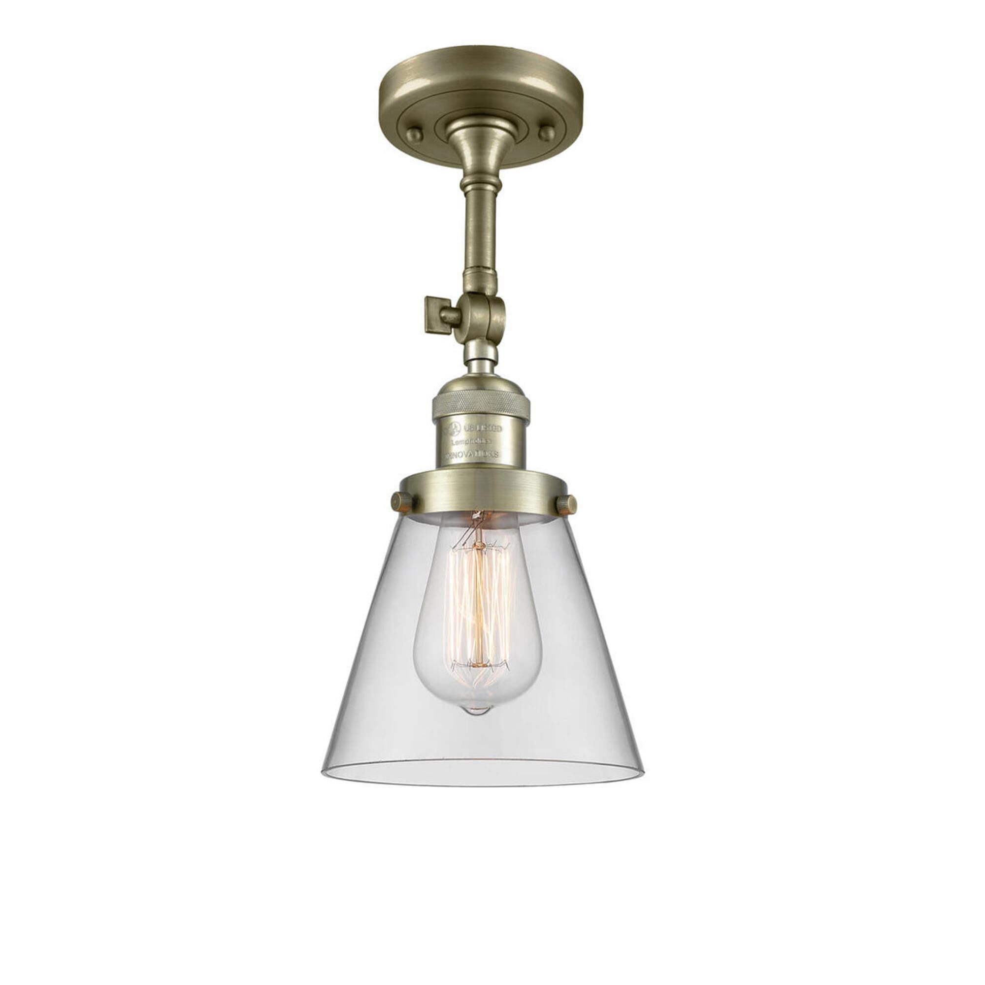Shown in Antique Brass finish and Clear glass and None accent
