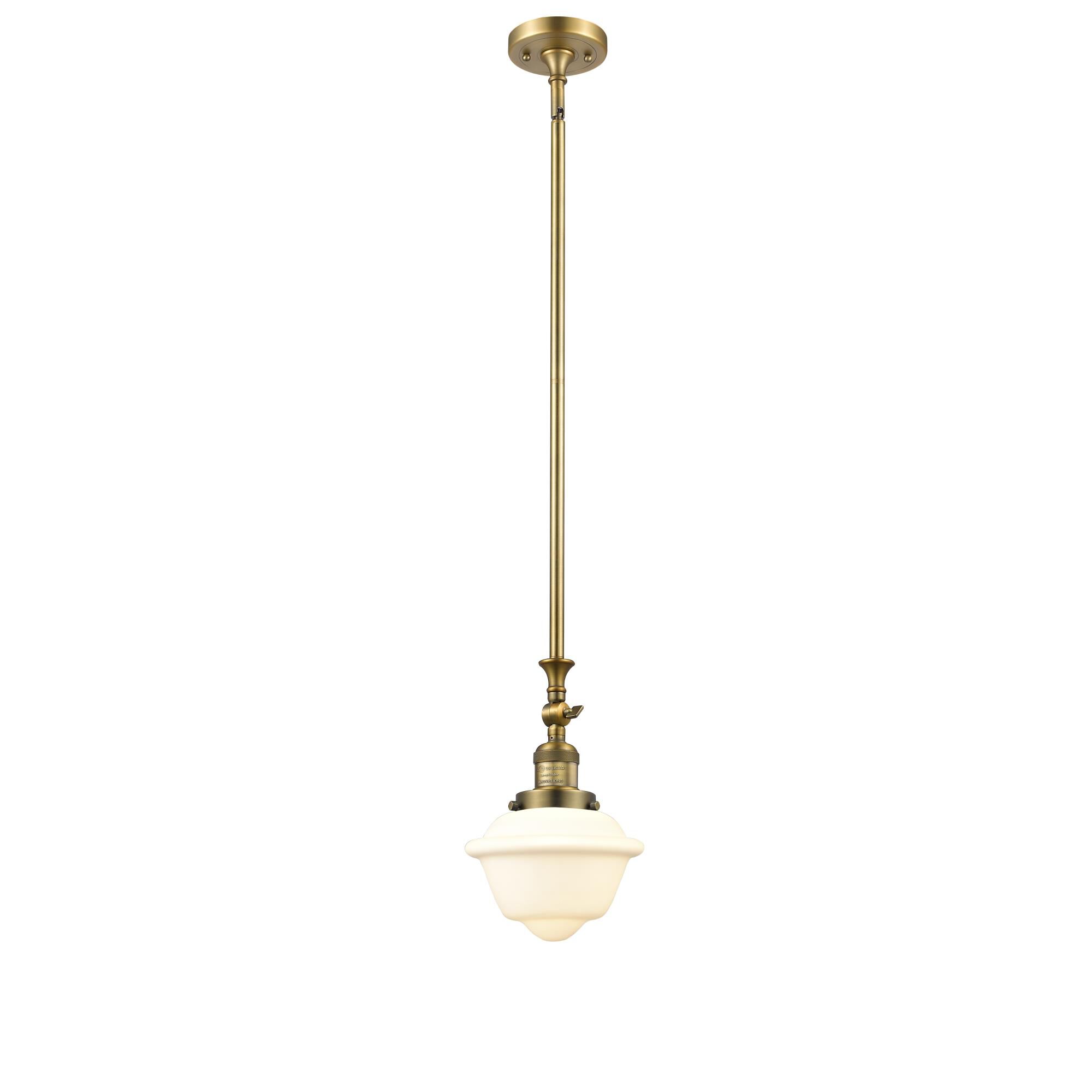 Shown in Brushed Brass finish and Matte White Cased glass