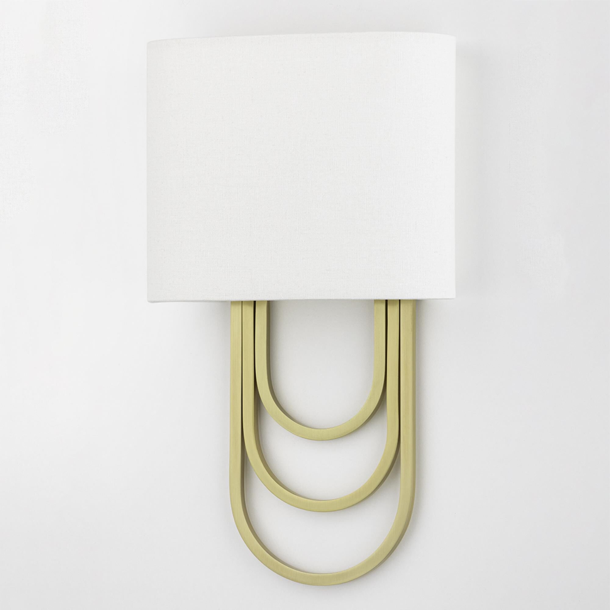 Shown in Aged Brass finish and White Linen shade