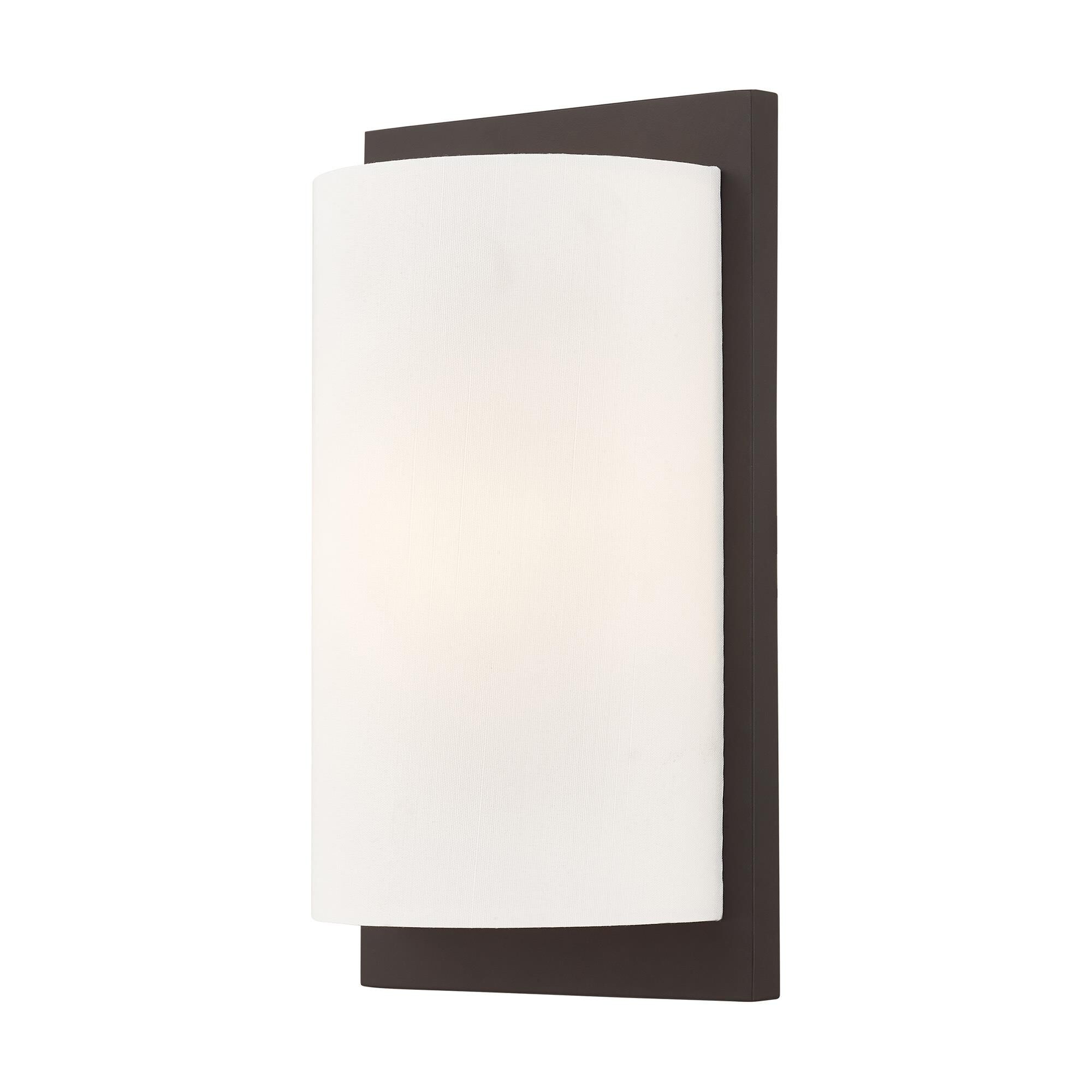 Shown in Bronze finish and Hand Crafted Off-White Fabric Hardback shade