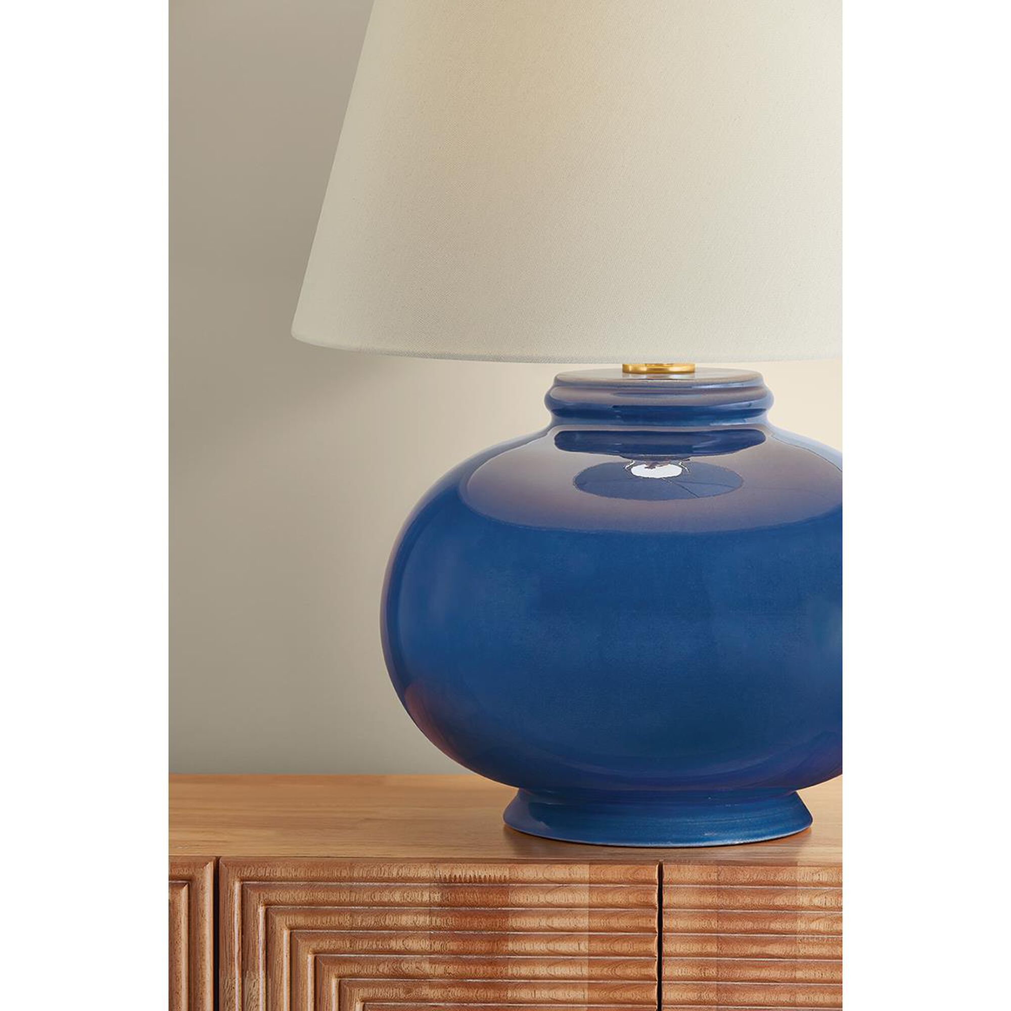 Shown in Aged Brass and Ceramic Parrish Blue finish and Off White Linen shade