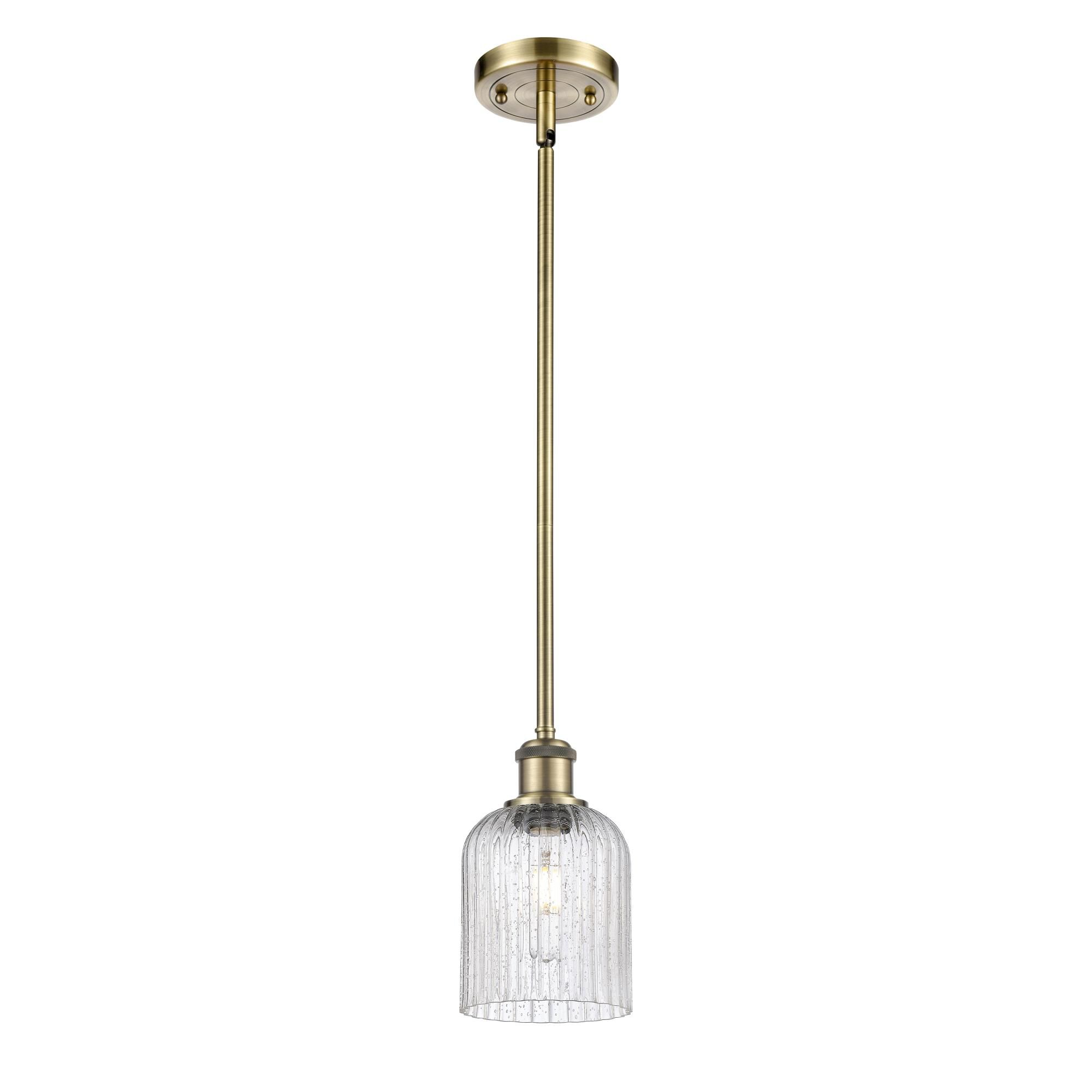 Shown in Antique Brass finish and Seedy shade